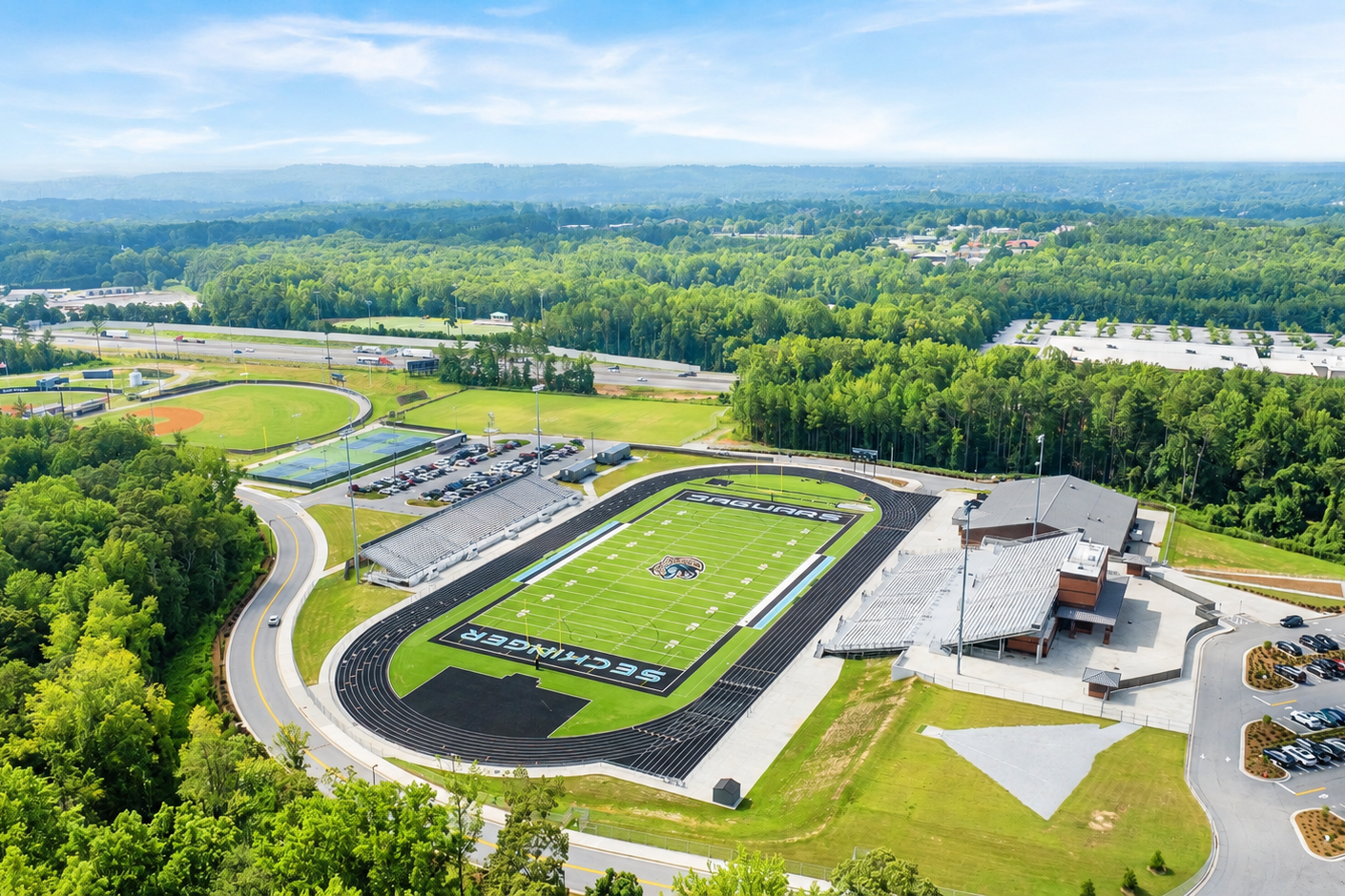 Aerial view of Seckinger High School football stadium near Grove at East Thompson in Buford, Georgia, by Davidson Homes.