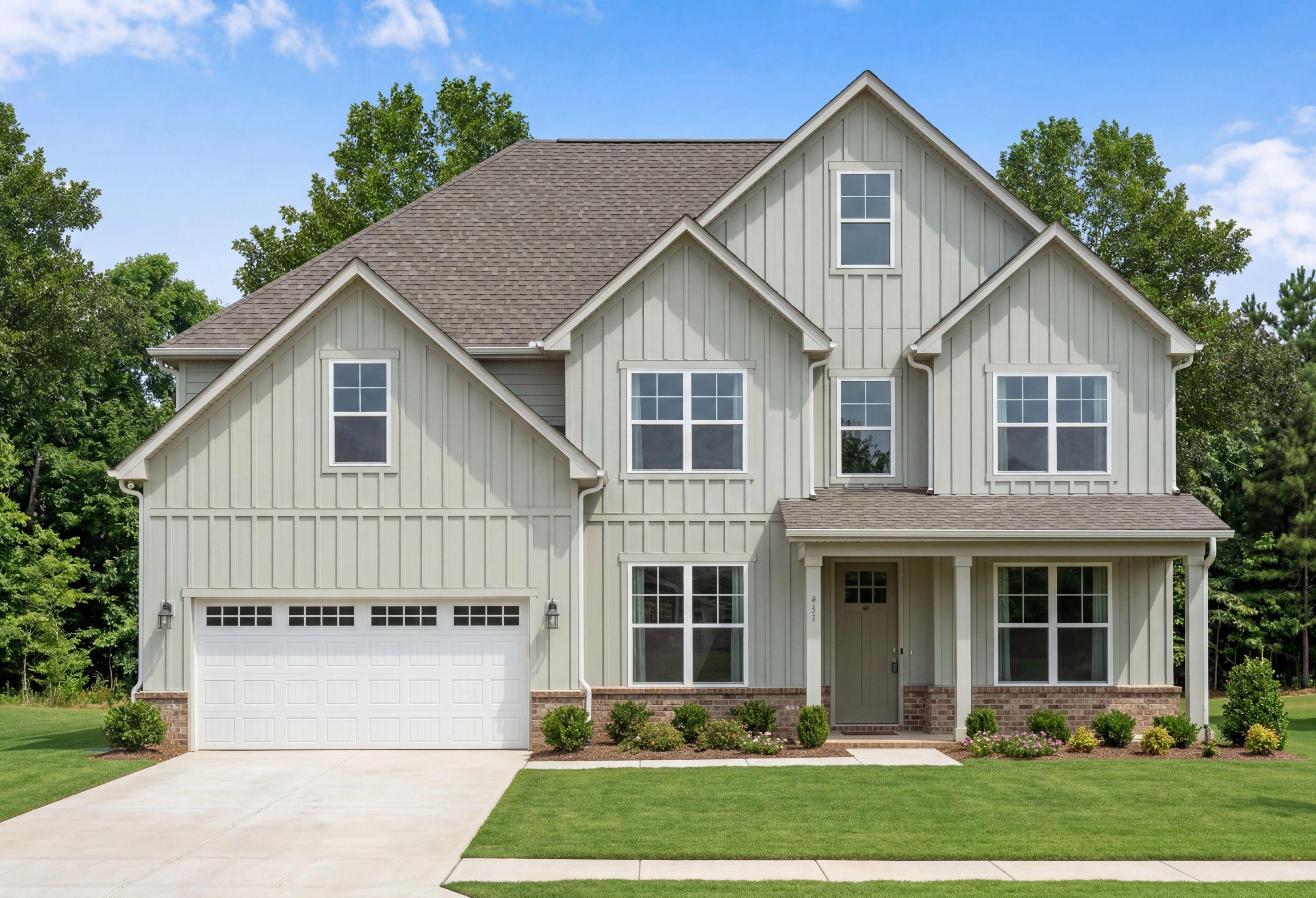 Two-story Madison D home design by Davidson Homes in Cullman, Alabama featuring board and batten siding and 2-car garage.