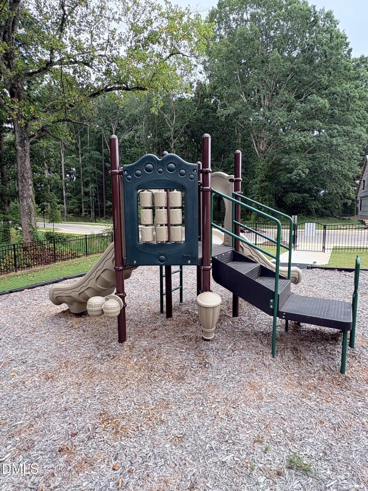 Playground equipment with slide and tic-tac-toe board at the Woodland Crossing community in Zebulon, North Carolina.