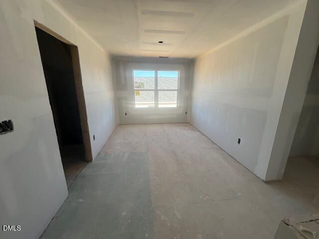 Unfinished room with new drywall and rear window in Davidson Homes' The Ash C plan, Retreat at North Main, Lillington, NC