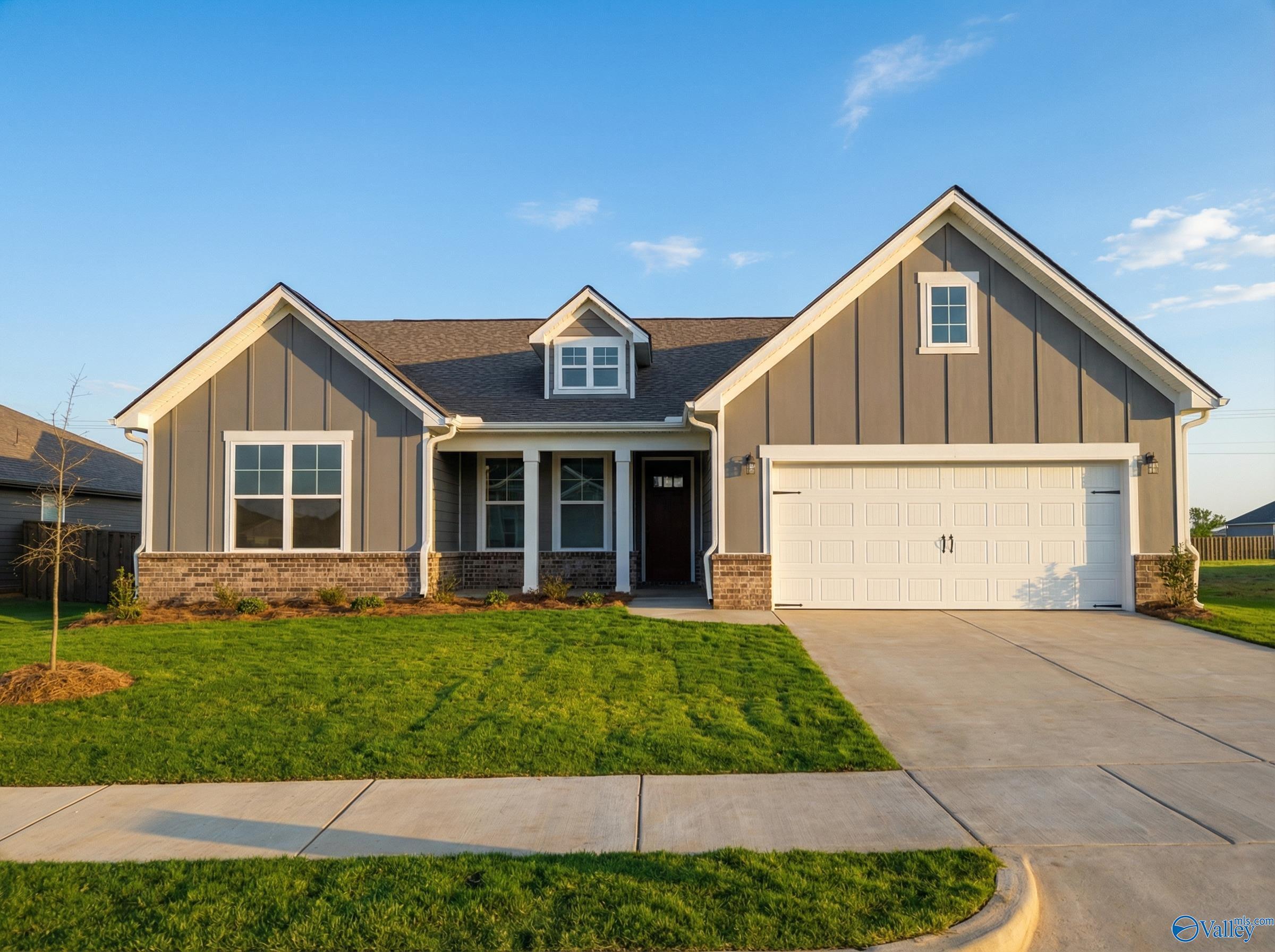 Gray single-story home with board-and-batten siding, 2-car garage, front porch in Anderson Farm, Athens, AL - Davidson Homes Rockford C