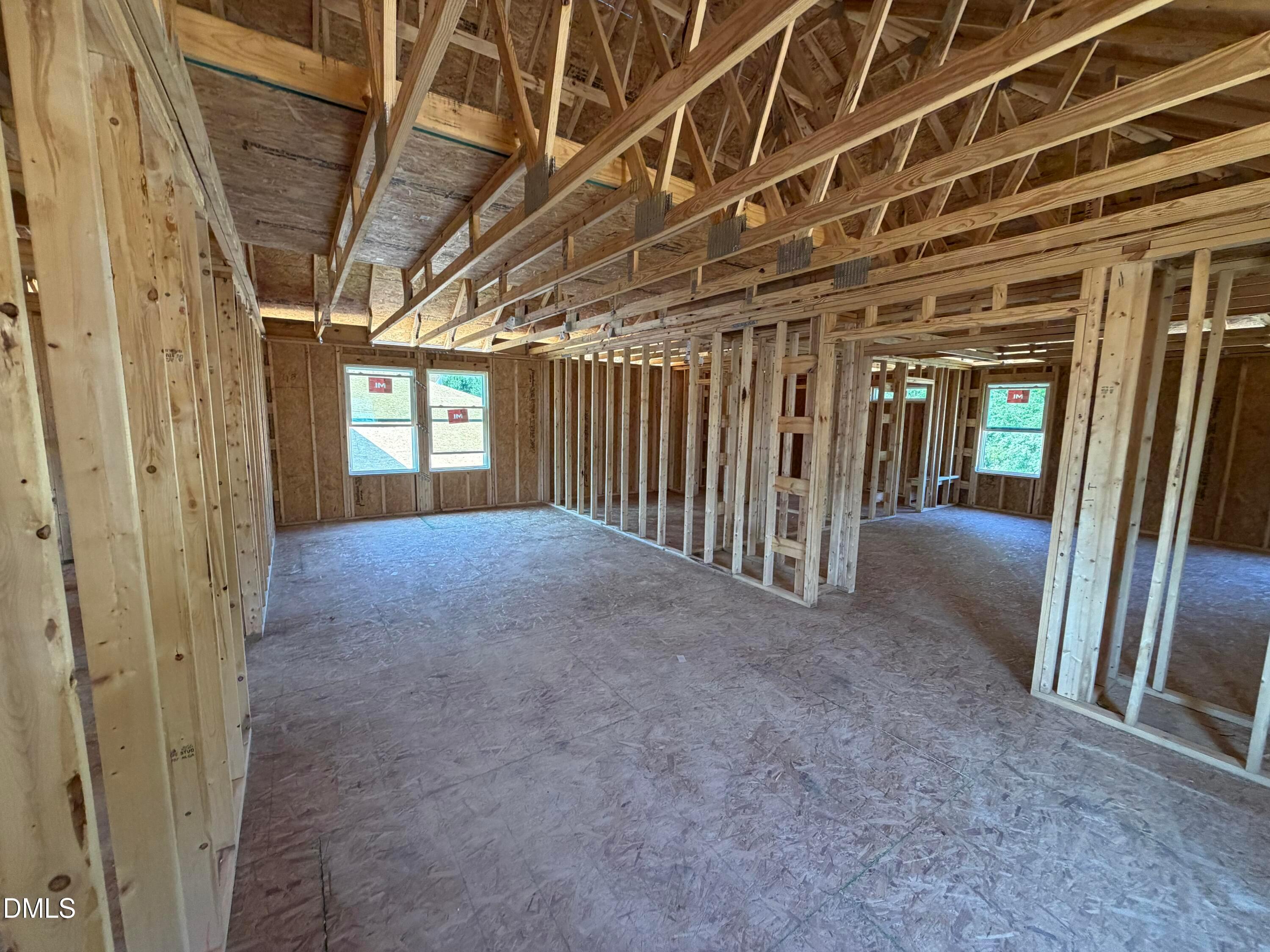 Wooden framing of open-concept interior in The Preston C floor plan at Wendell Ridge in Wendell, North Carolina.