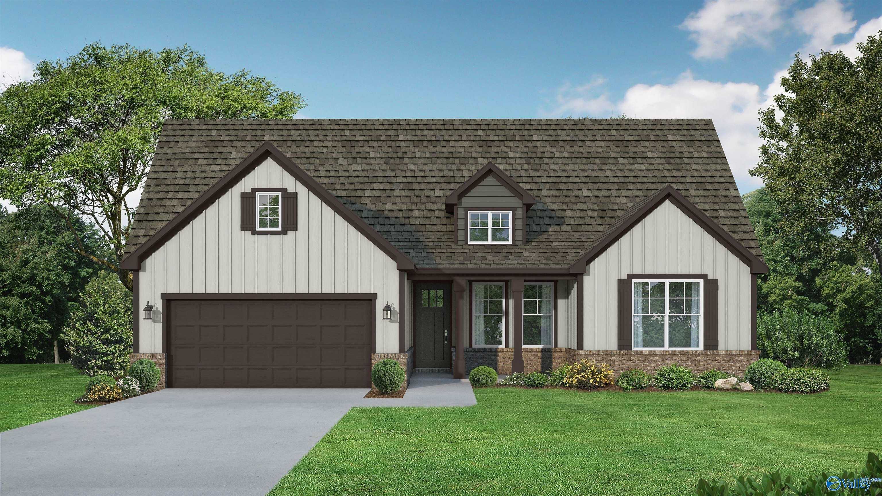 Modern single-story Rockford C home exterior with beige siding, dark garage door, gabled roof, and landscaped yard in Athens, AL