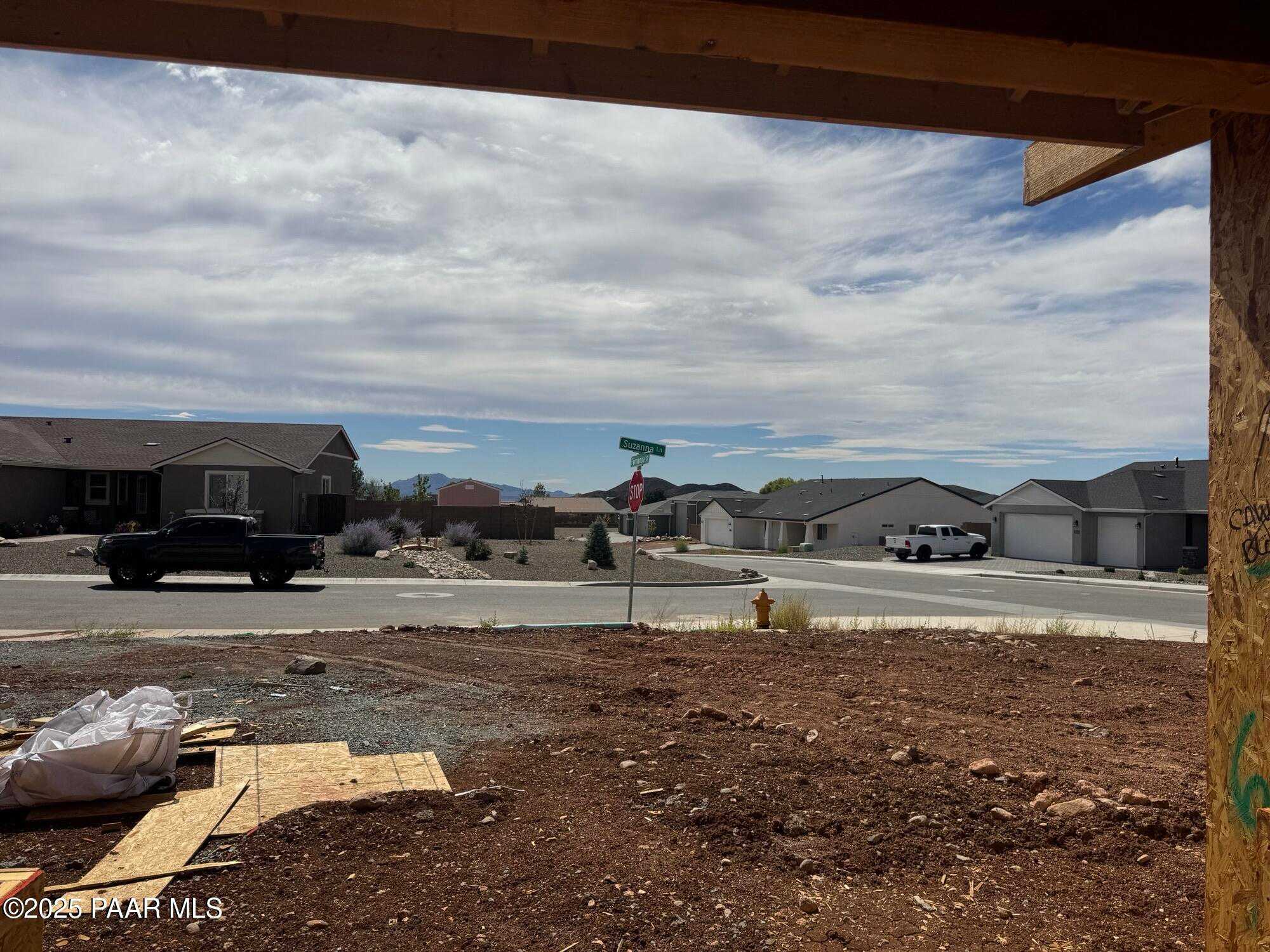 Framed 1-story 3-bedroom home with 3-car garage under construction by Evermore Homes, The Monarch B in Morningstar, Prescott Valley, Arizona