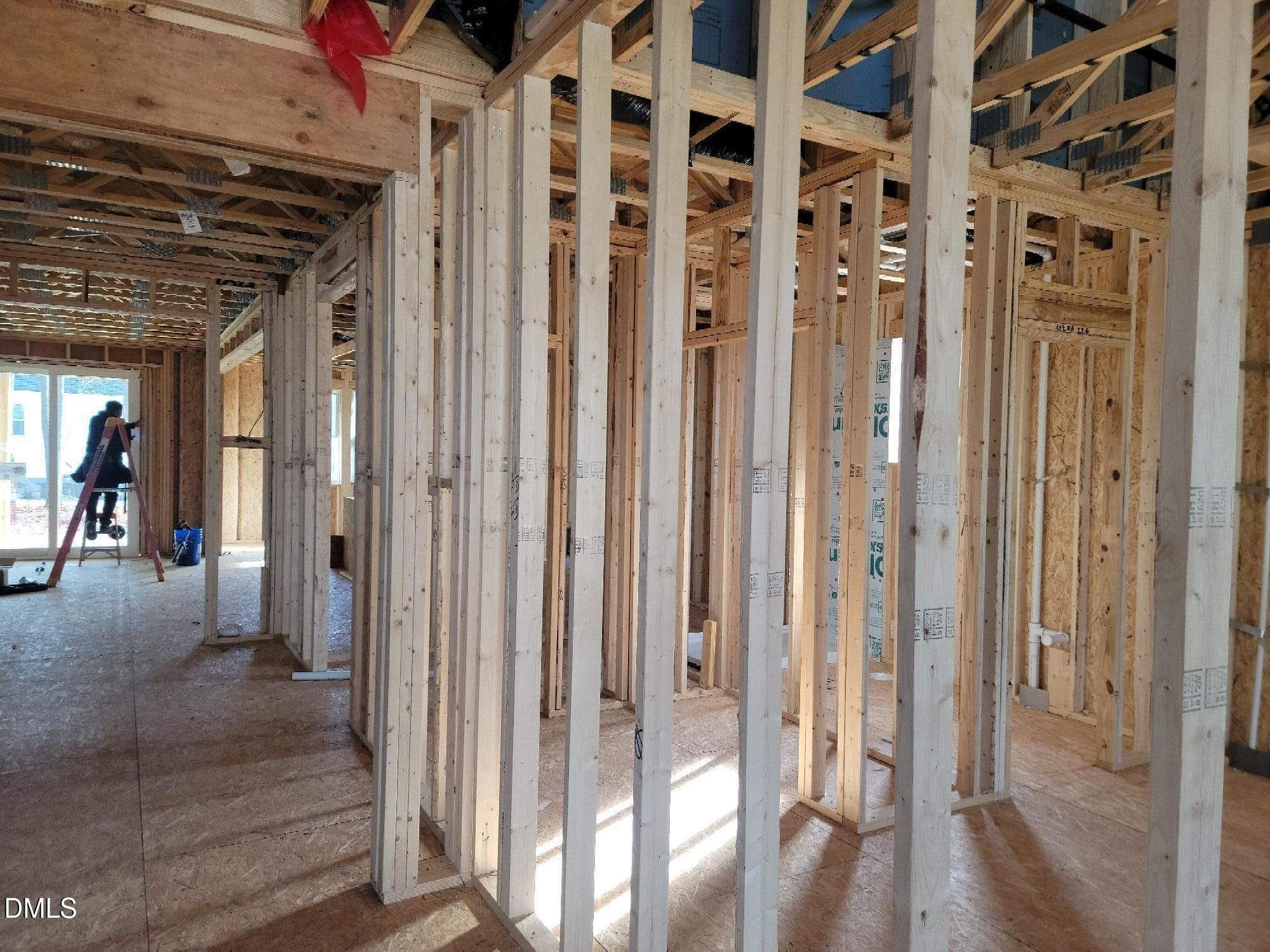 Interior wooden framing with exposed studs and beams in Davidson Homes The Cypress B II, Angier, North Carolina