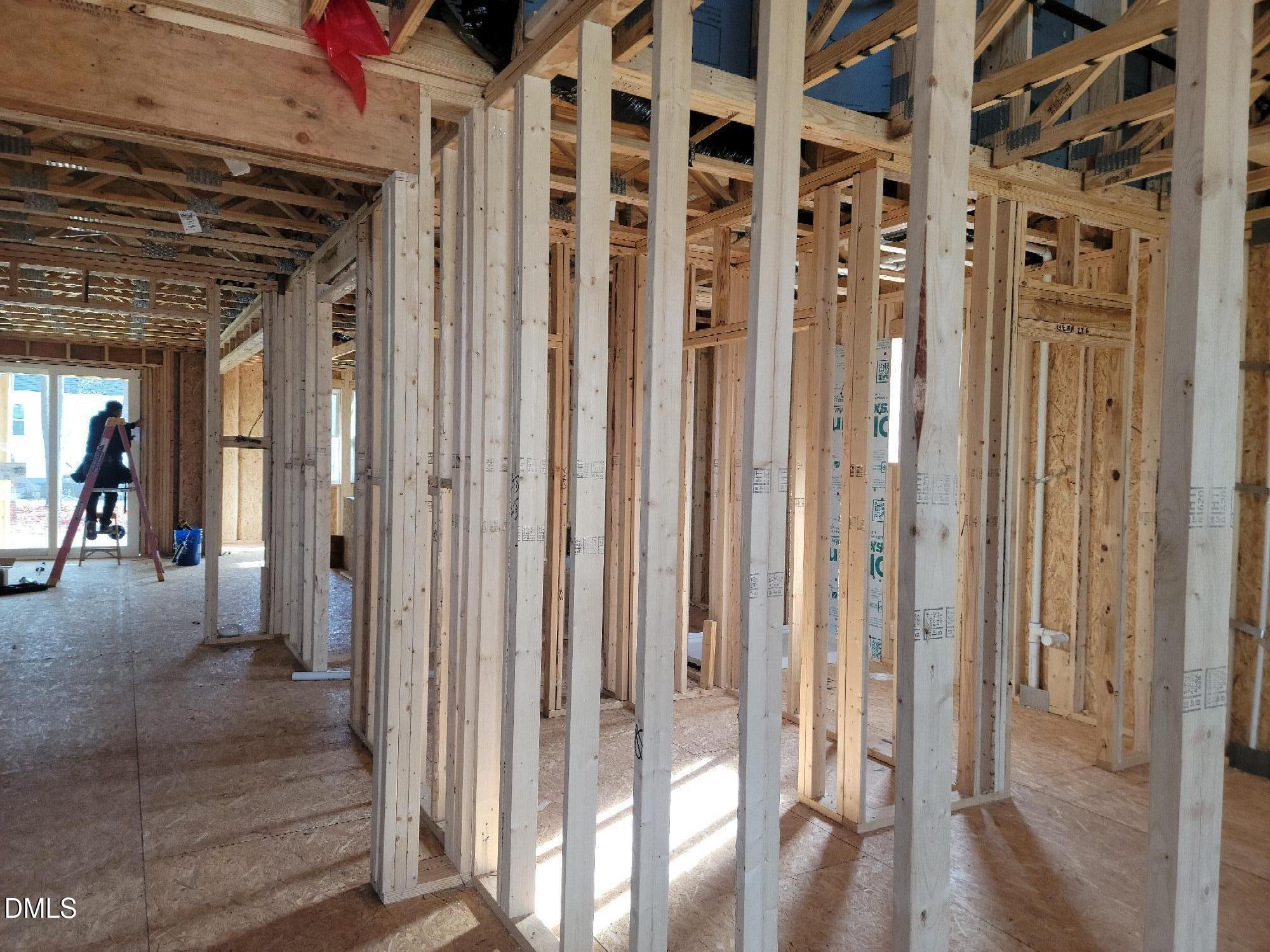 Interior wooden framing with exposed studs and beams in Davidson Homes The Cypress B II, Angier, North Carolina