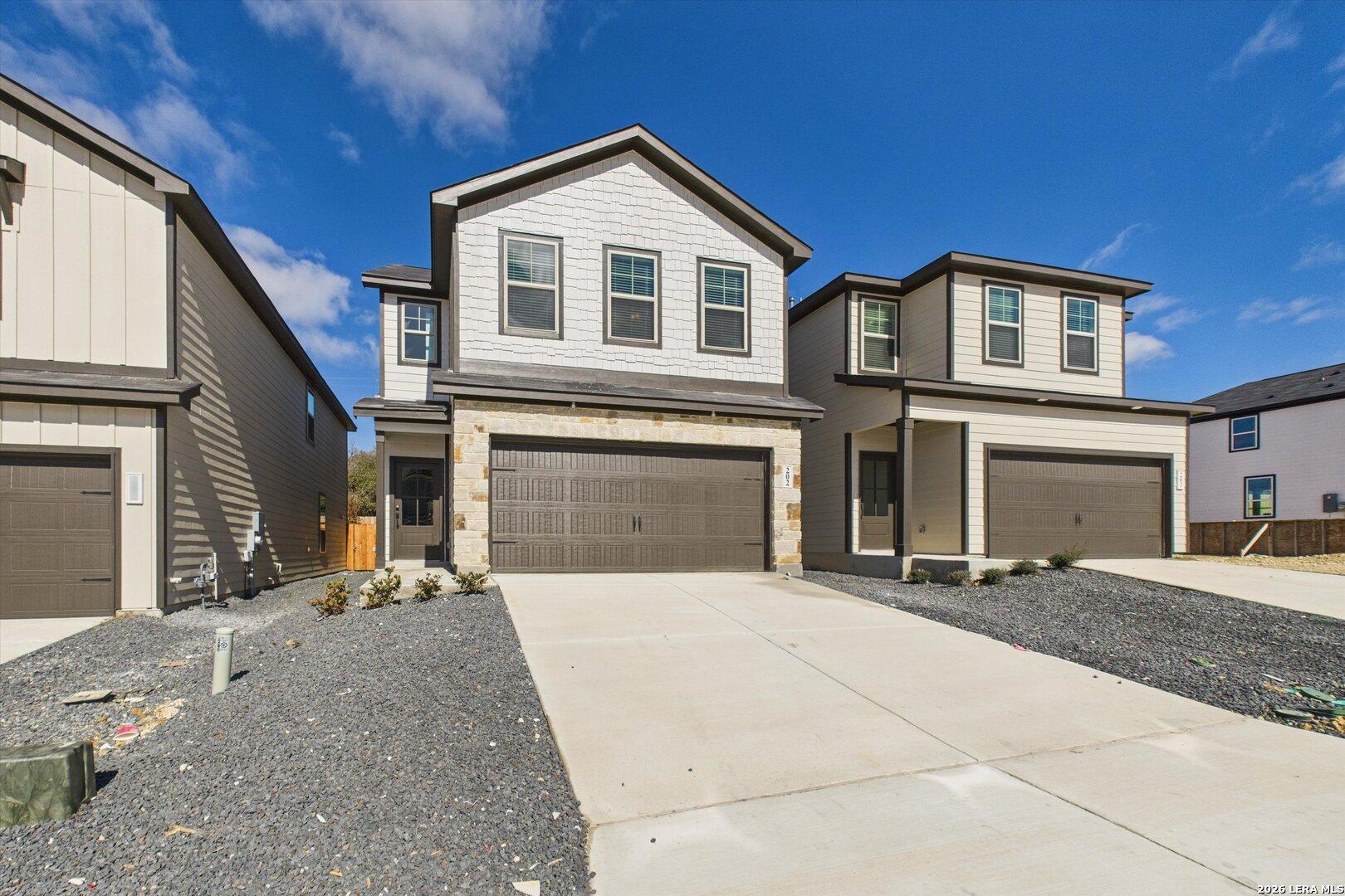 Modern 2-story 4-bedroom home with 2-car garage and stone accents in Meadows at Oak Creek, San Antonio, Texas by Davidson Homes