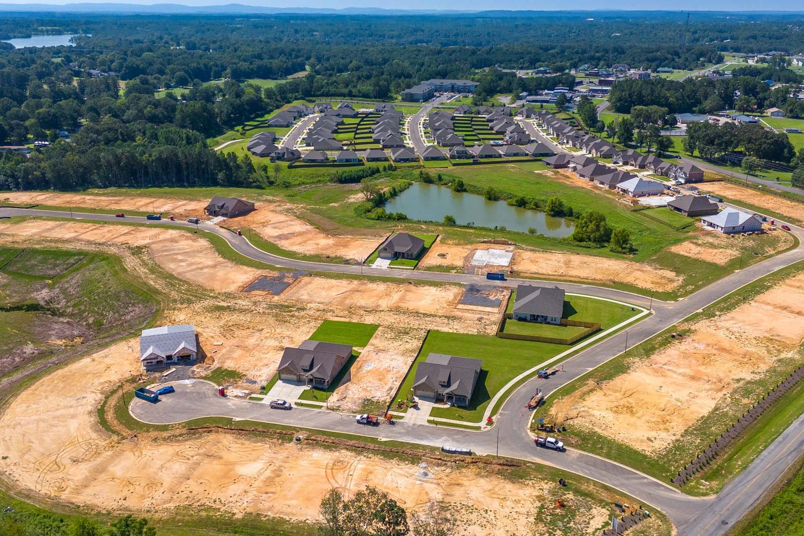 Aerial view of North Ridge neighborhood in Cullman Alabama with new homes ponds green spaces and construction by Davidson Homes