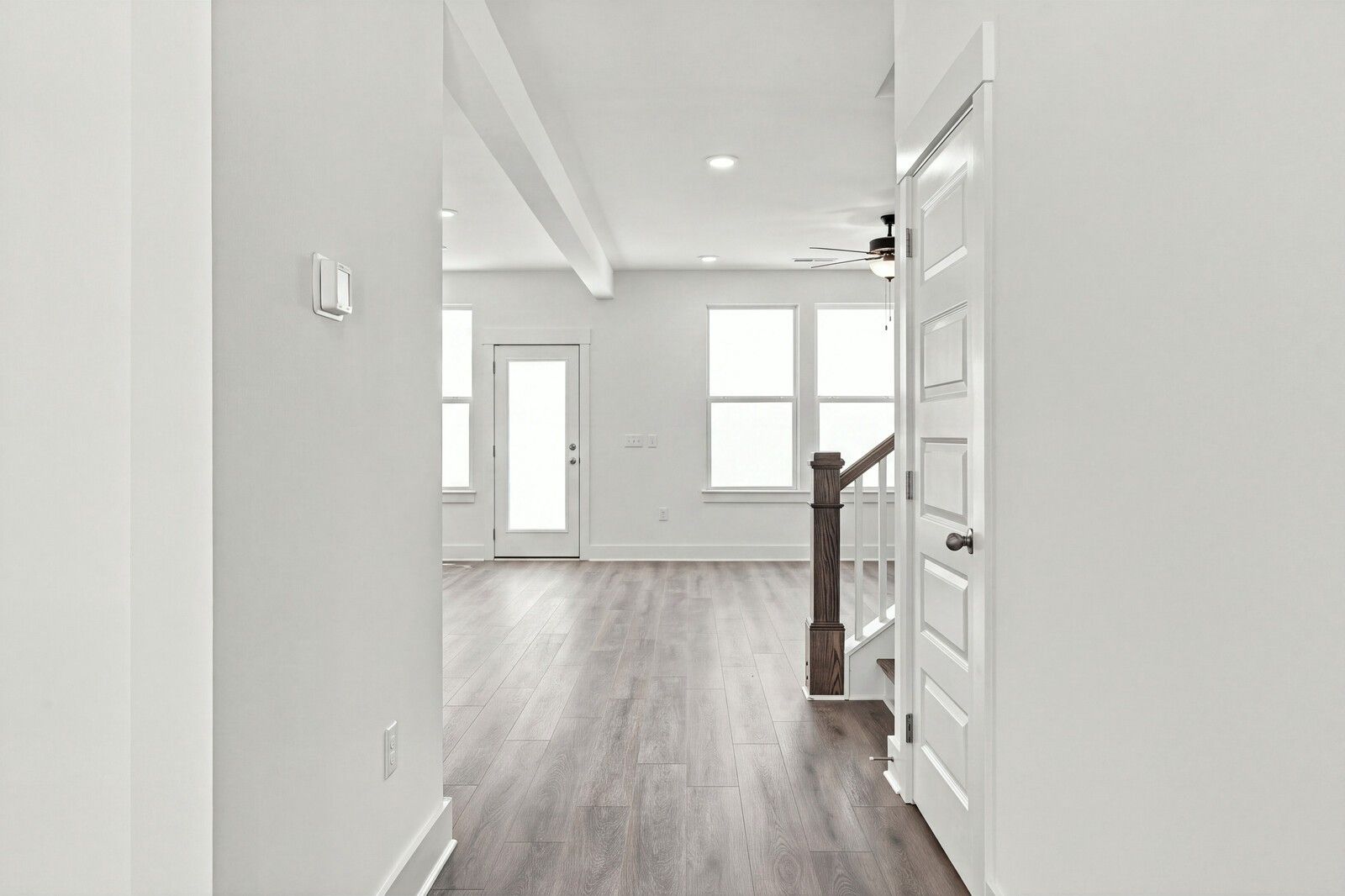 Bright open foyer with luxury vinyl plank flooring and staircase in Davidson Homes The Willow B, Woods Crossing, Gallatin, TN