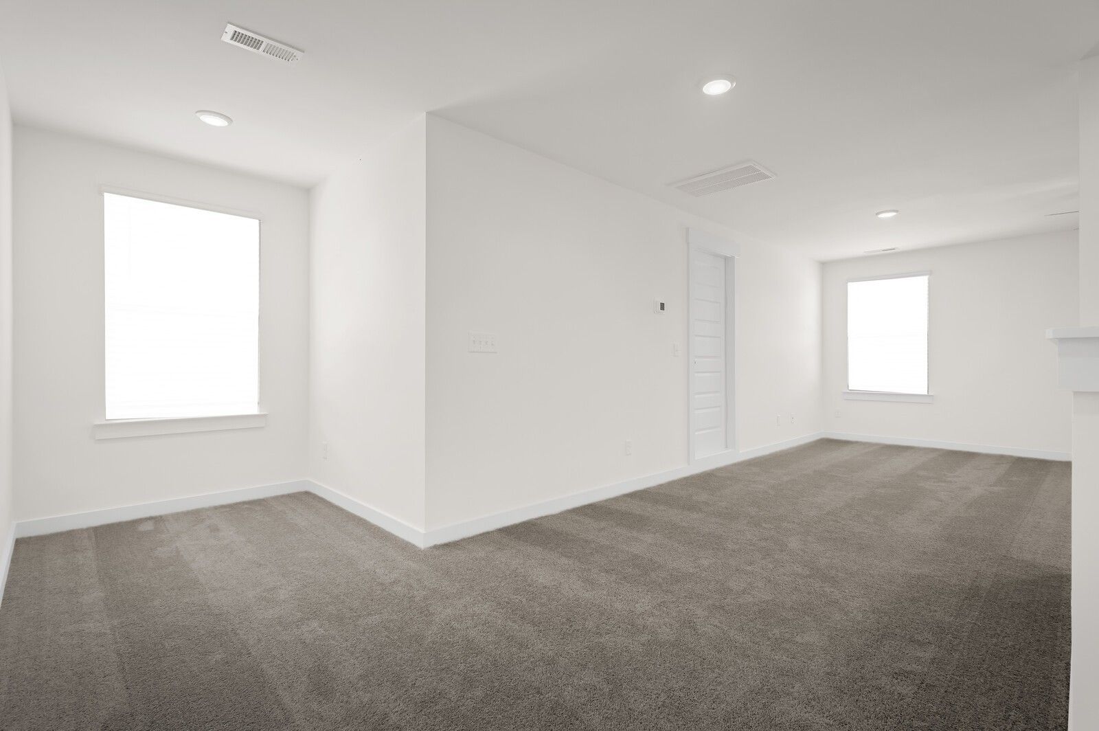 Bright, carpeted loft or flex space in The Ash A floor plan by Davidson Homes in Woods Crossing, Gallatin, Tennessee.