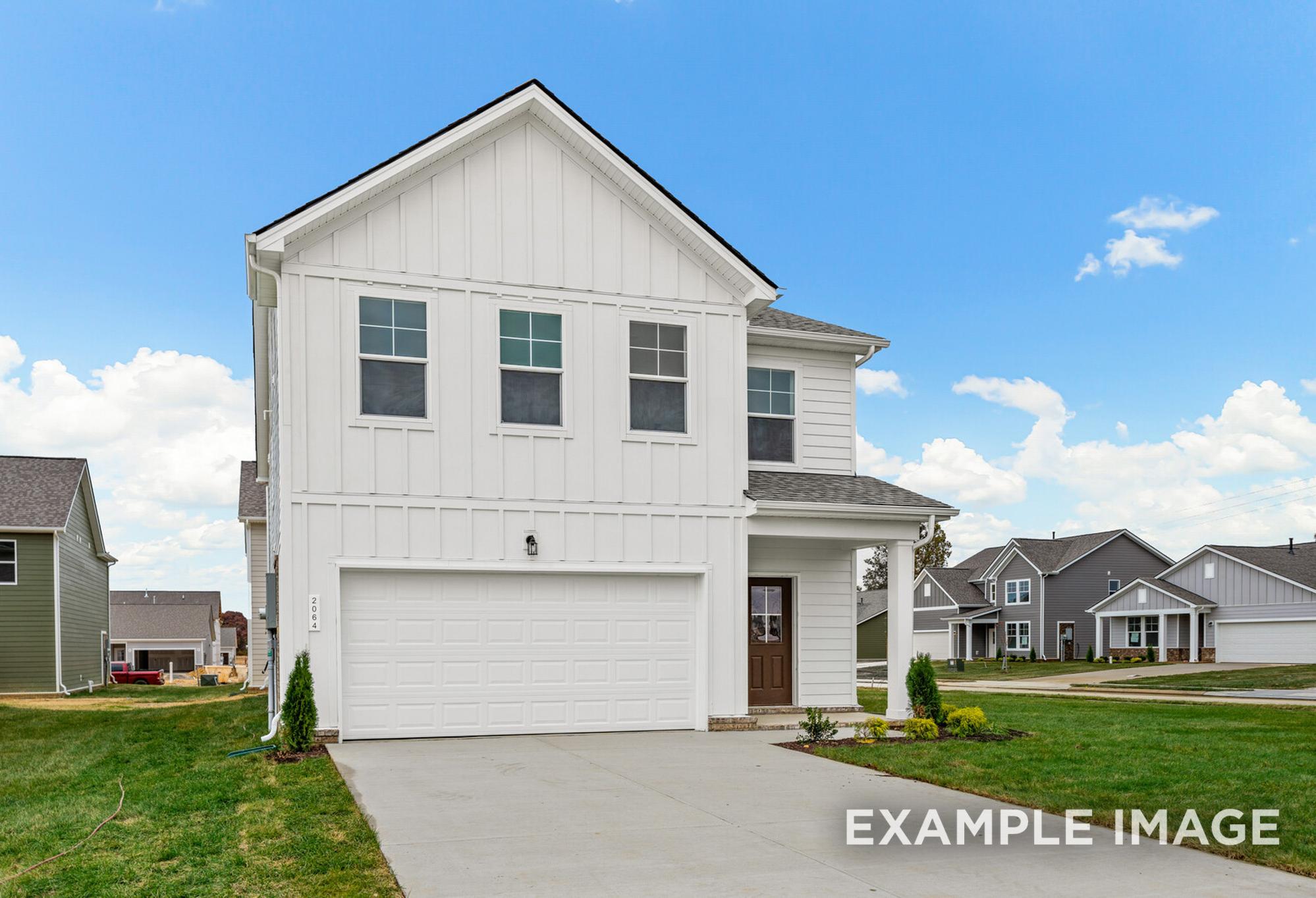 Two-story Grayson A home exterior with white board-and-batten siding, gabled roof, two-car garage, and front porch in White House, TN