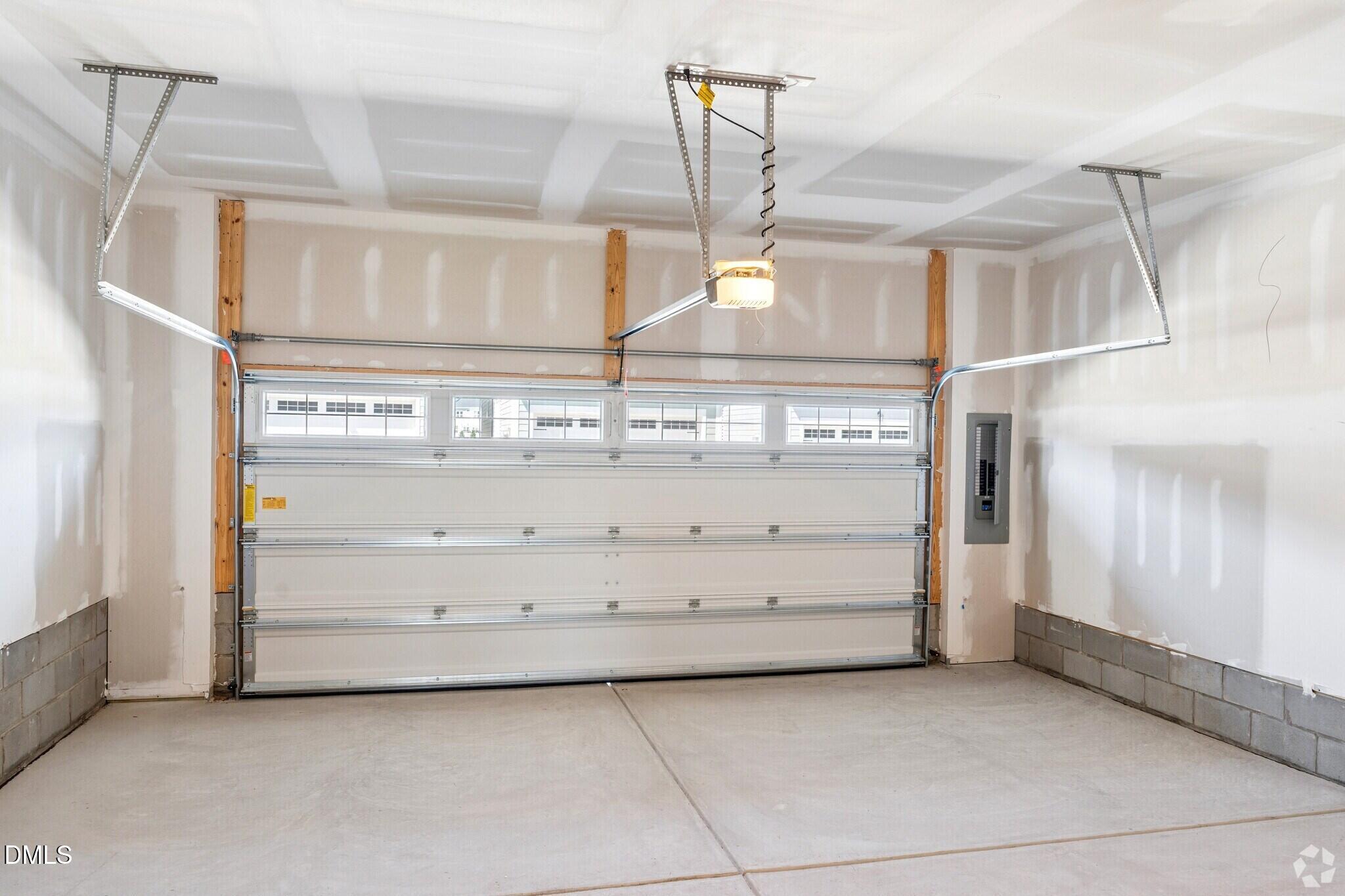 Spacious 2-car garage with windowed door and opener in Davidson Homes townhome, Forestville Yard, Knightdale, North Carolina