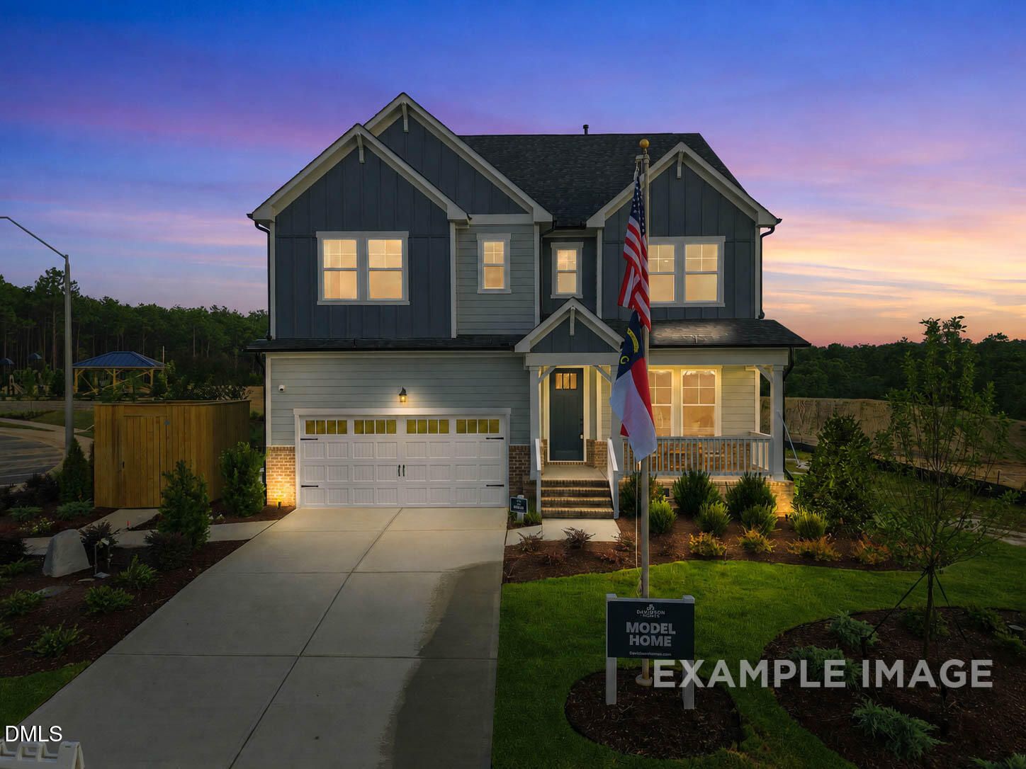 3-story Beech B floor plan by Davidson Homes with 2-car garage at twilight in Montrose, Aberdeen, North Carolina.