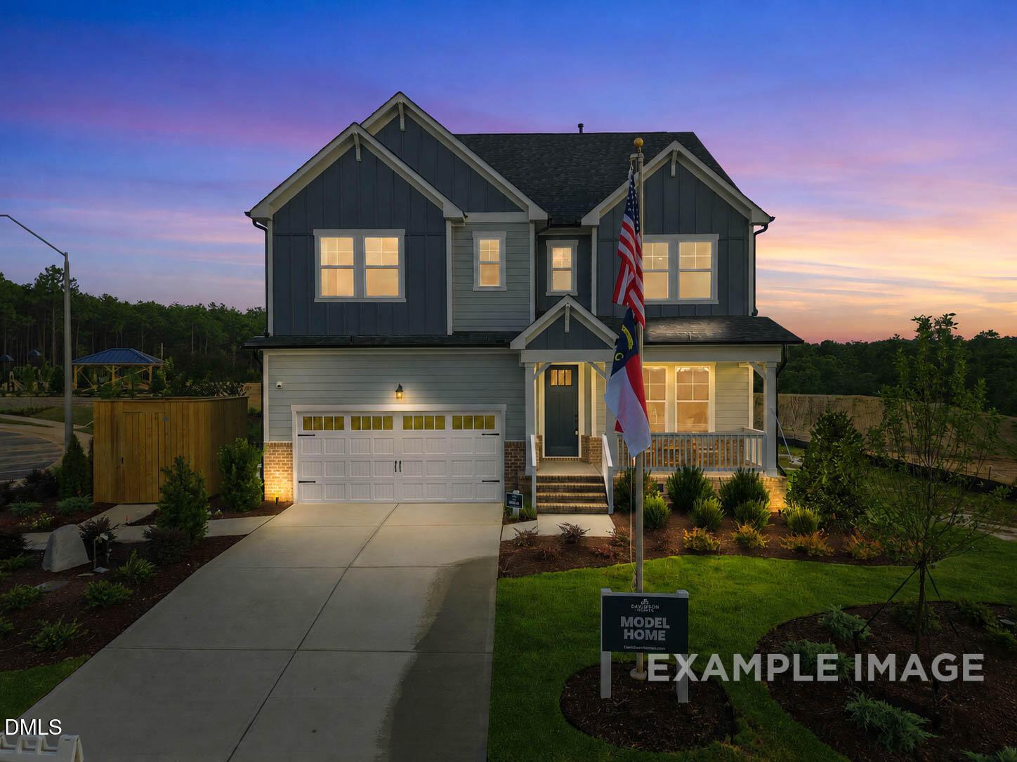 3-story Beech B floor plan by Davidson Homes with 2-car garage at twilight in Montrose, Aberdeen, North Carolina.