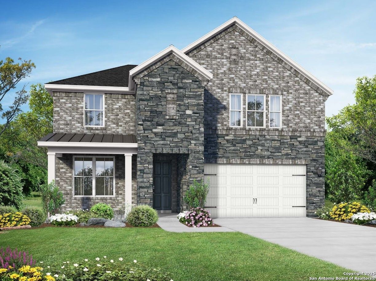 Modern 2-story stone-brick home with 2-car garage, front porch, lush landscaping in Horizon Pointe, Converse, Texas - Davidson Homes Sequoia C