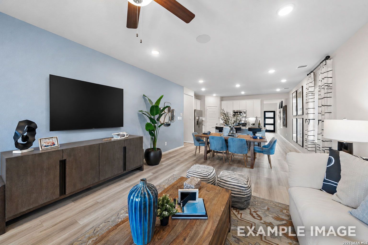 Open-concept living and dining area in The San Marcos F floor plan by Davidson Homes in Rayburn Valley, San Antonio, Texas.