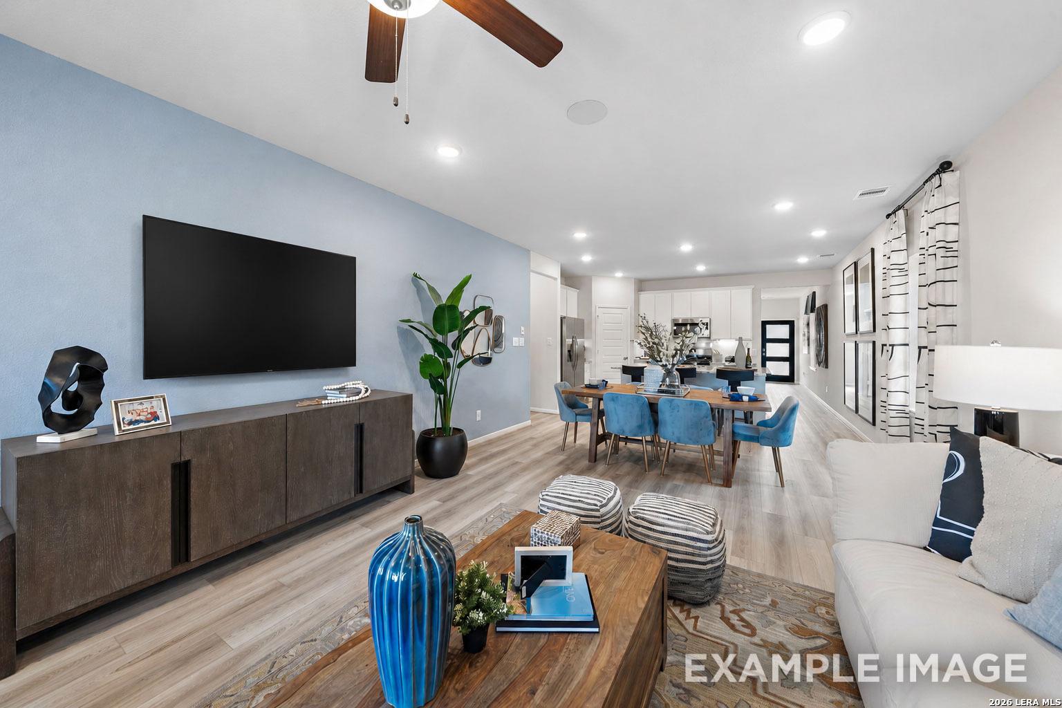 Open-concept living and dining area in The San Marcos F floor plan by Davidson Homes in Rayburn Valley, San Antonio, Texas.