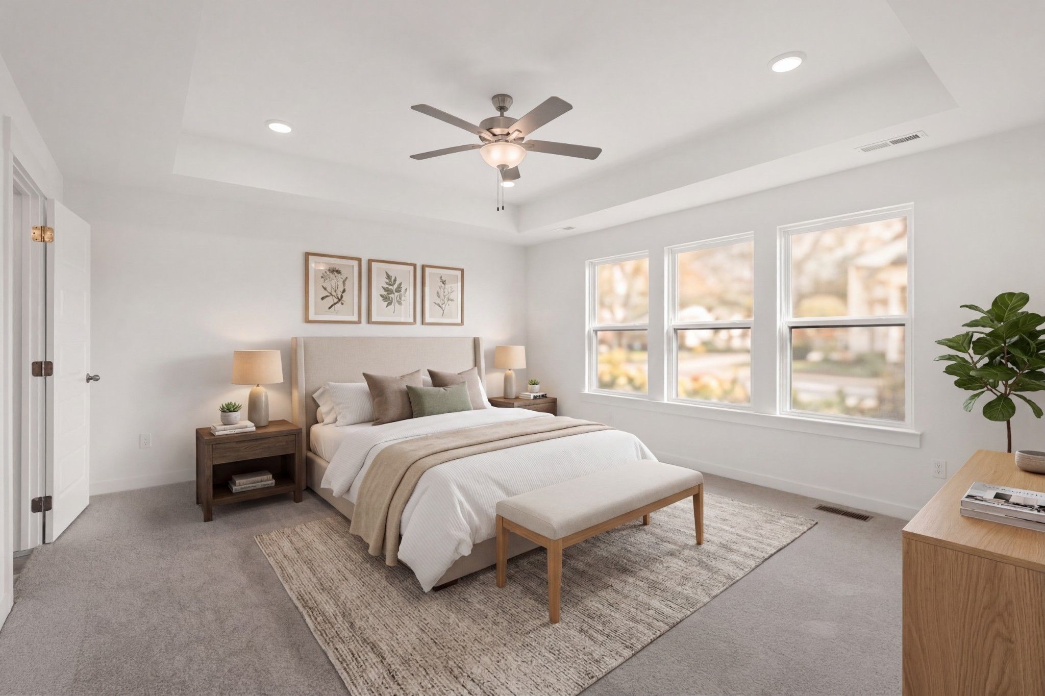 Bright primary bedroom with tray ceiling in The Willow D floor plan by Davidson Homes, Benders Cove, Mt. Juliet, Tennessee.