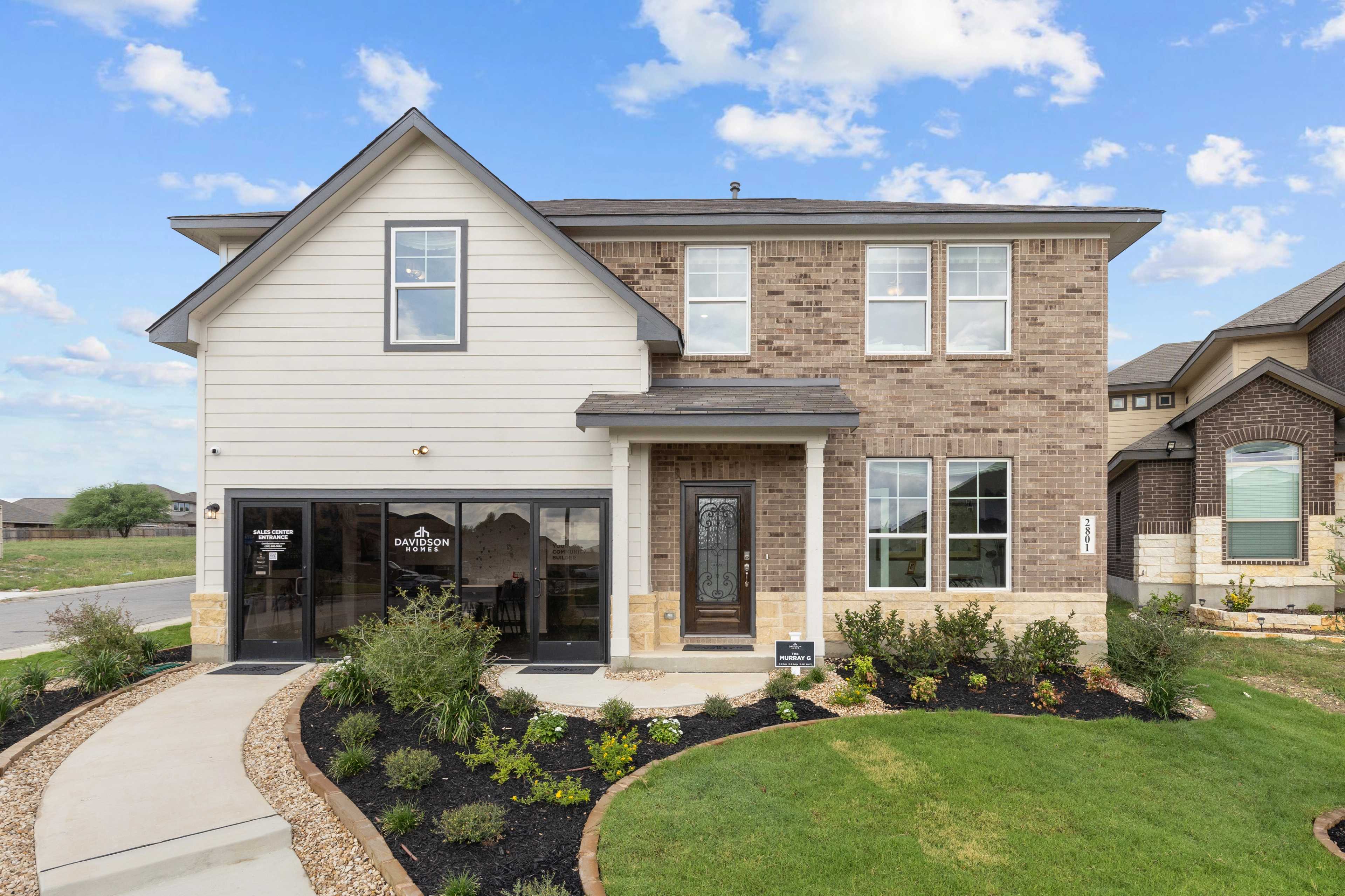 Contemporary brick and siding home exterior at Horizon Pointe in Converse Texas with covered porch and landscaped yard