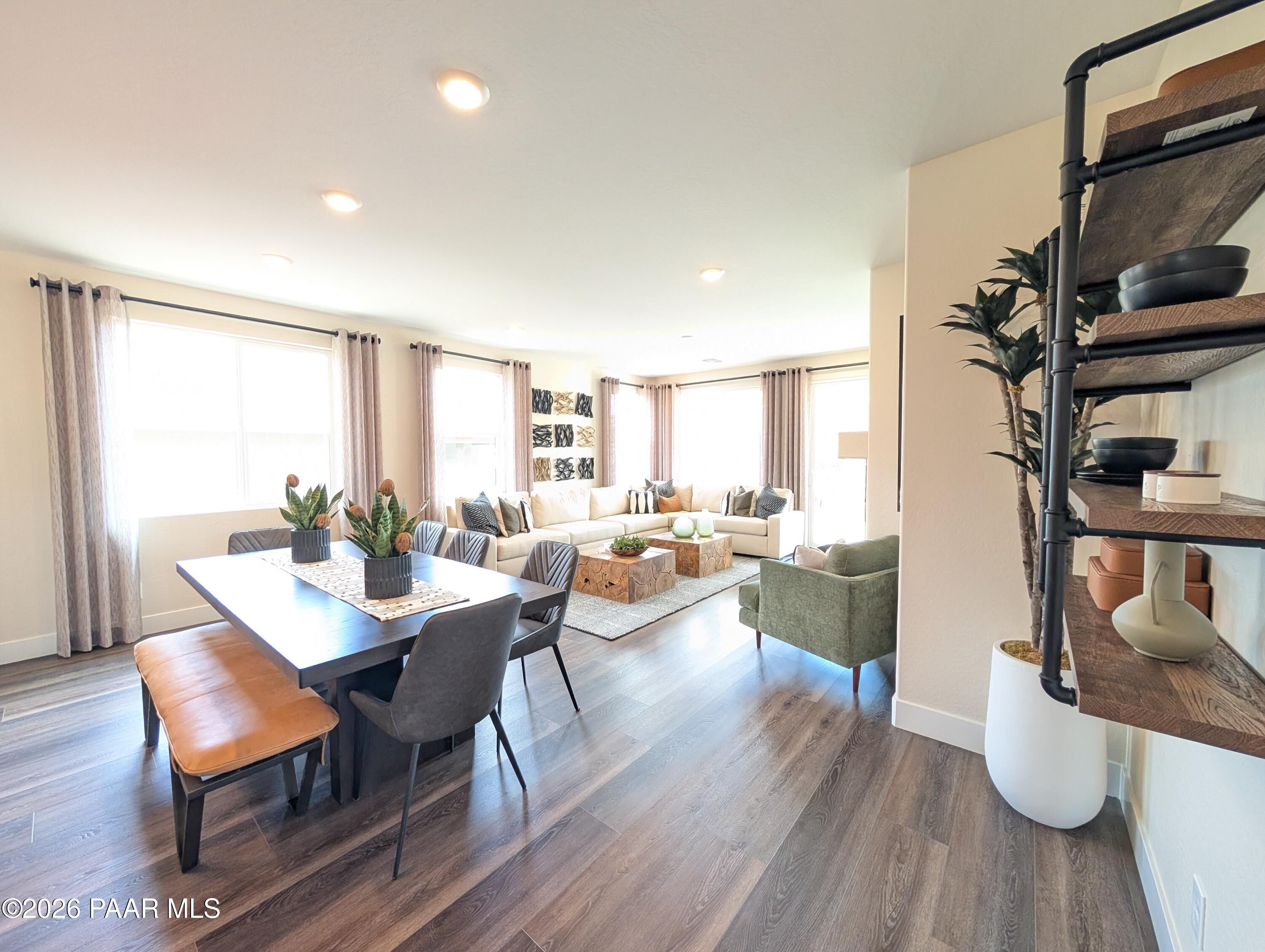 Open-concept living and dining area in The Boulder II H floor plan at South Ranch Western Collection, Prescott, Arizona.