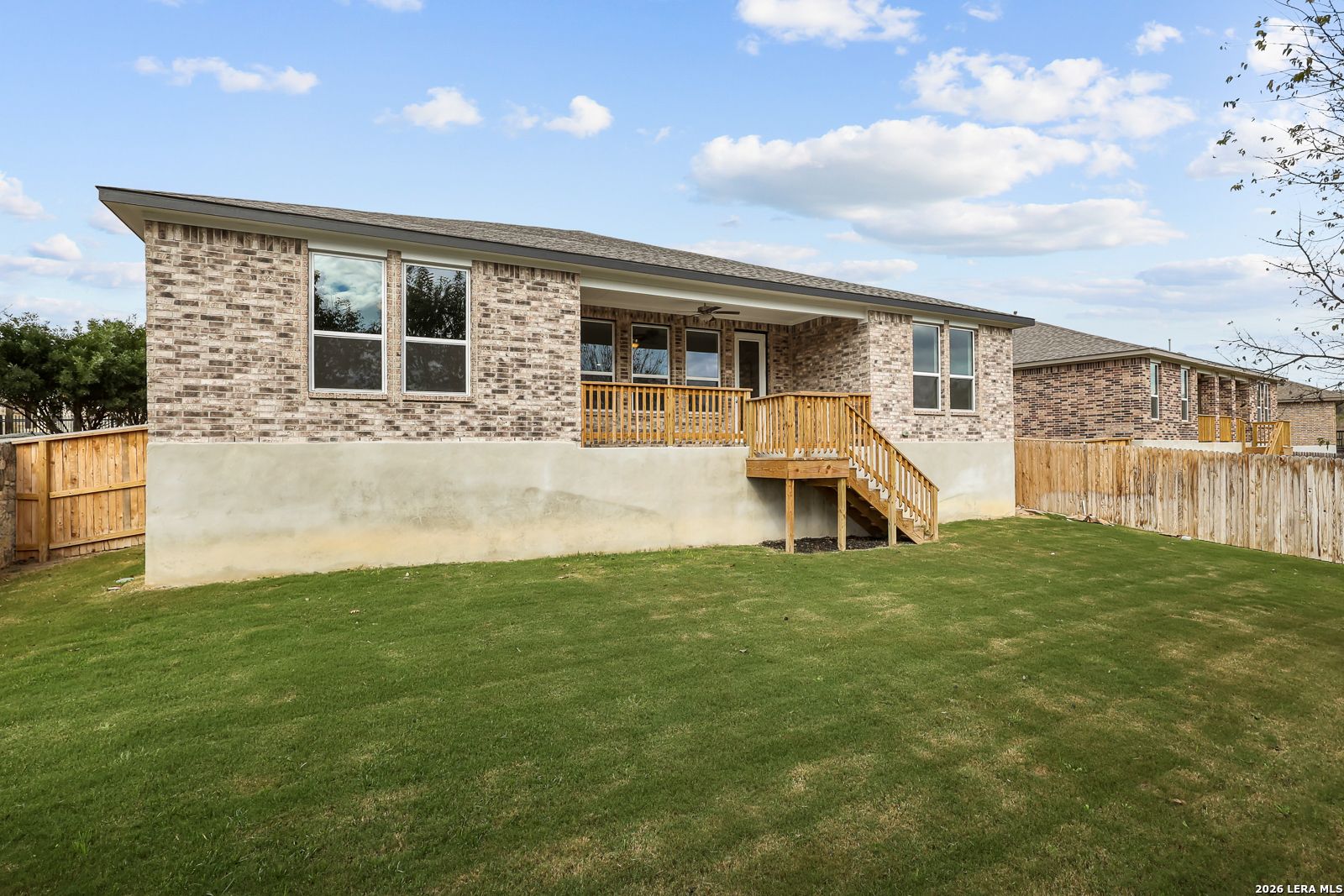 Backyard and wooden deck of The Lanier H home by Davidson Homes in Ladera, San Antonio, Texas.