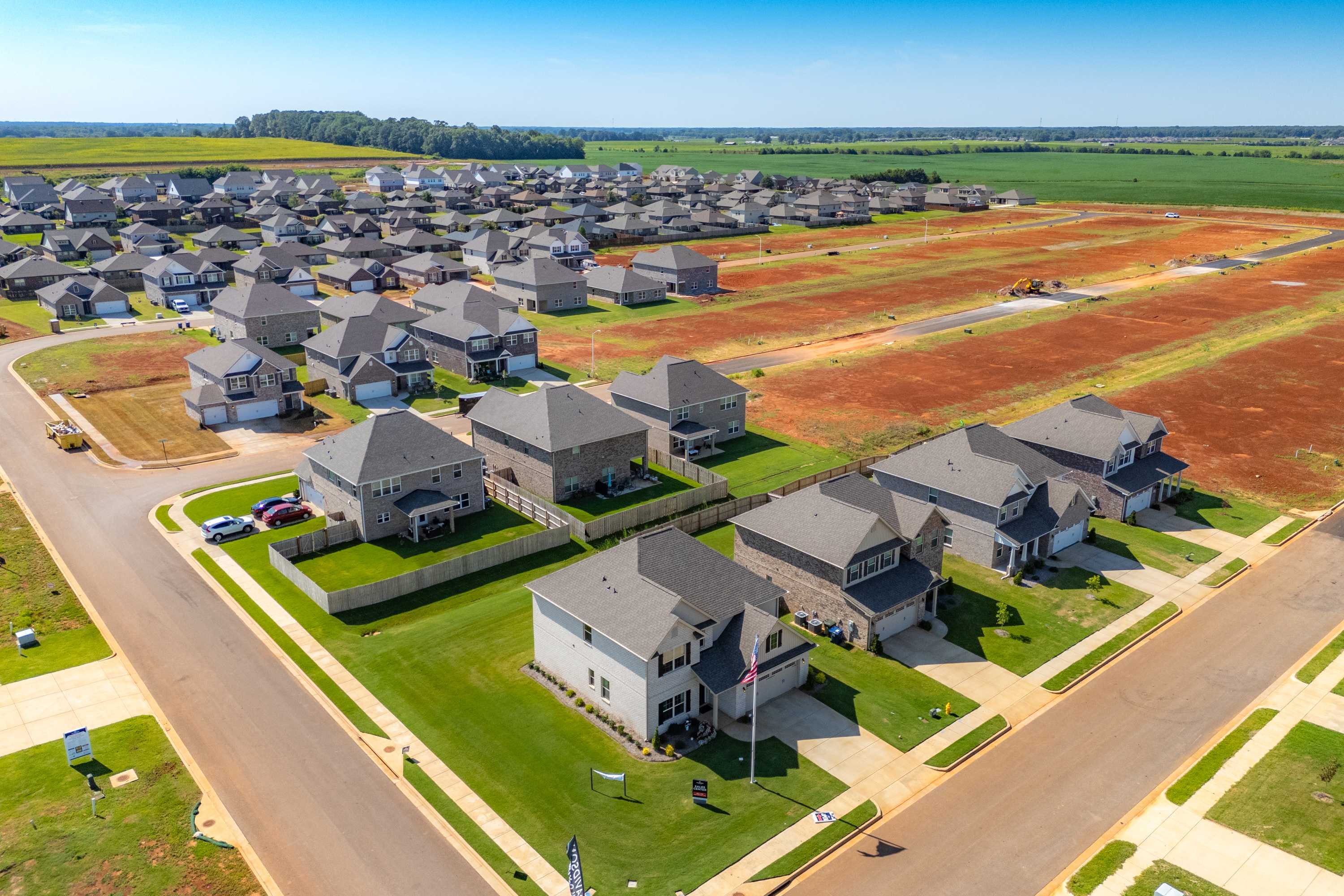 Aerial view of Walker's Hill neighborhood in Meridianville AL with new homes, construction lots, and surrounding farmland