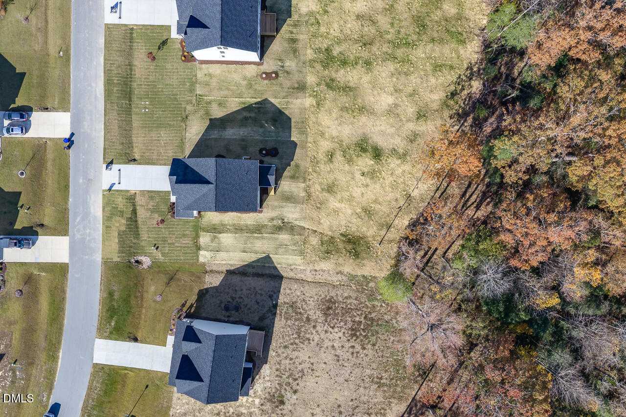 Aerial view of 2-story Davidson Homes with 2-car garages and lawns in Wellers Knoll, Lillington, North Carolina The Gavin C plan
