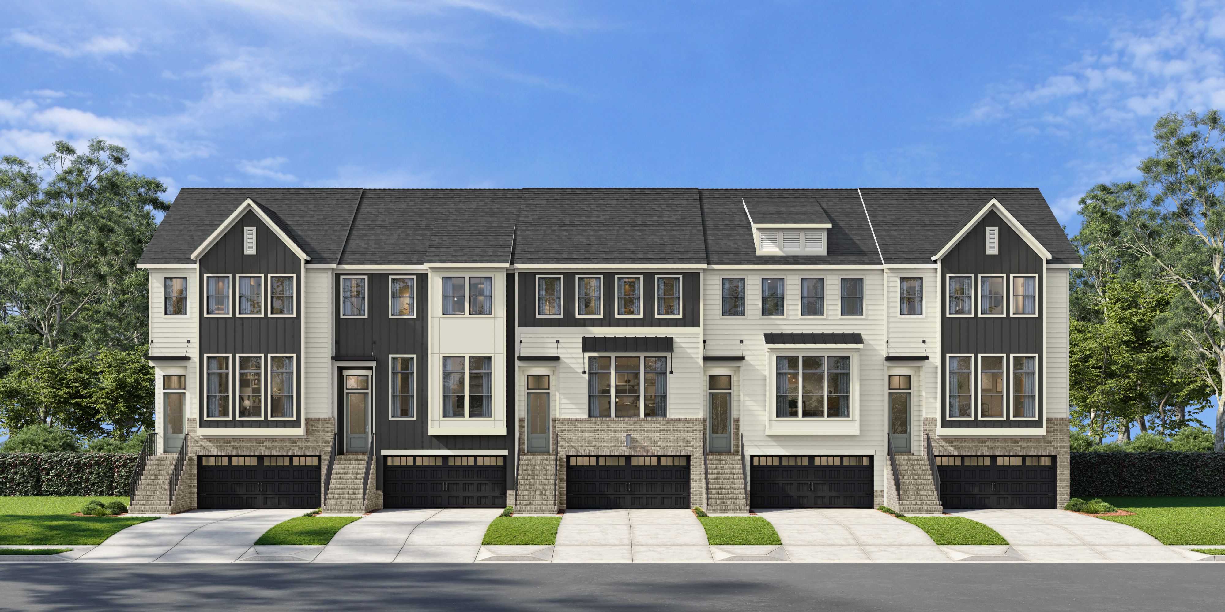 Modern townhome exterior at Bradford in Raleigh, North Carolina by Davidson Homes featuring brick and siding facade.