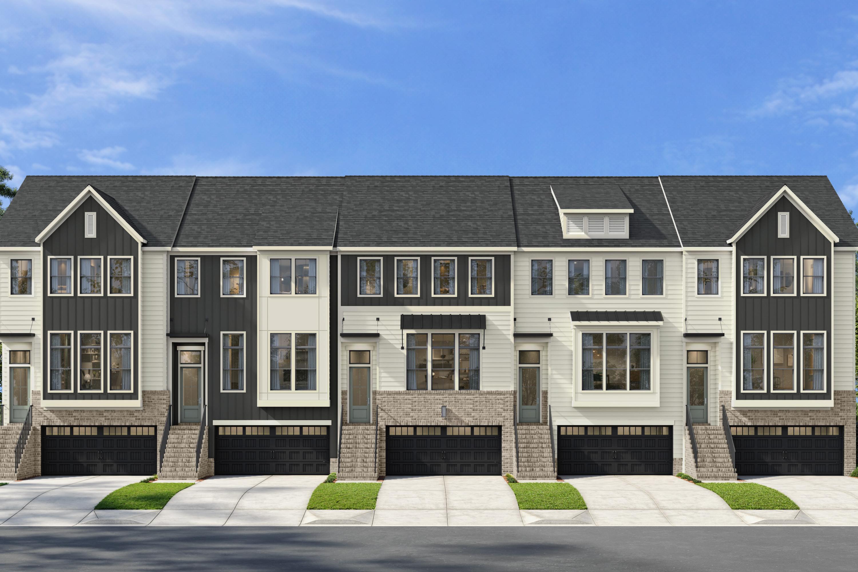 Modern townhome exterior at Bradford in Raleigh, North Carolina by Davidson Homes featuring brick and siding facade.
