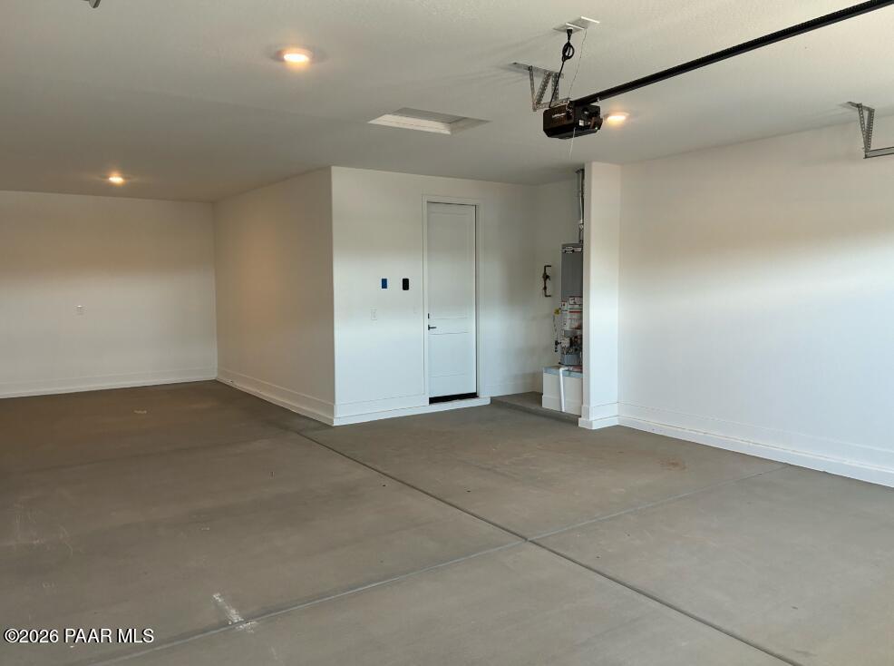 Spacious 3-car garage with finished walls in The Durango II G floor plan at South Ranch Western Collection, Prescott, AZ.