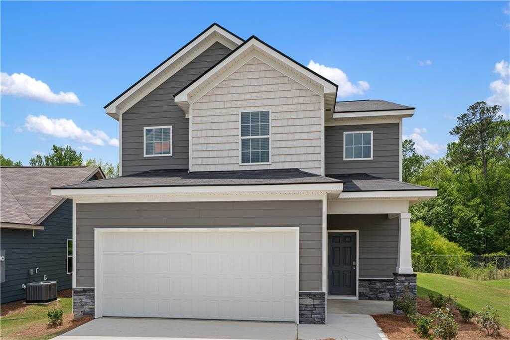 Modern 2-story Bartlett home with gray-white siding, 2-car garage, front porch in Summer Vineyard, Phenix City, Alabama