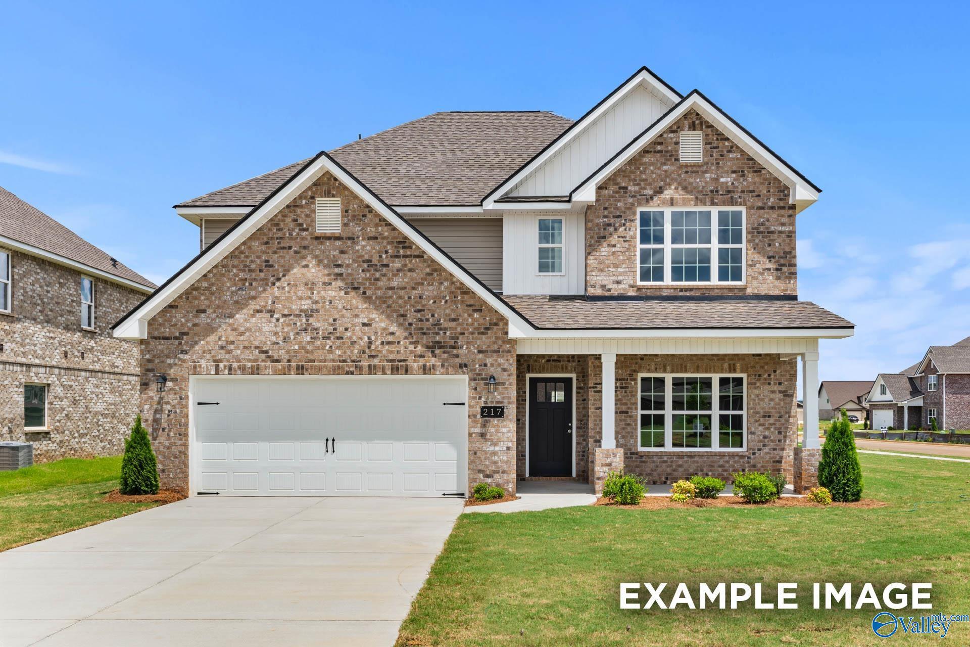 Modern two-story brick home with 2-car garage, front porch, and landscaping in Ivy Hills, Toney, Alabama by Davidson Homes The Chelsea B