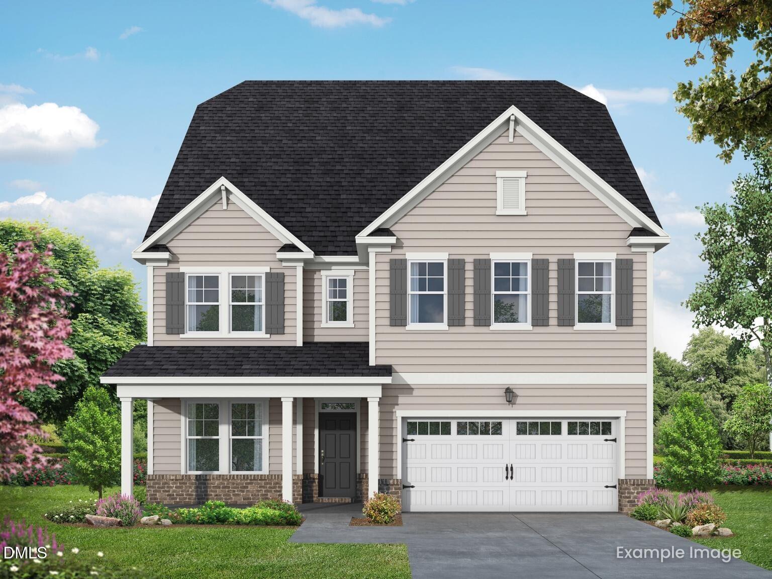 Beige Craftsman-style 3-story home with gabled roof, columned porch, 2-car garage, shutters, and lush landscaping in Wake Forest, NC - Davidson Homes Aspen