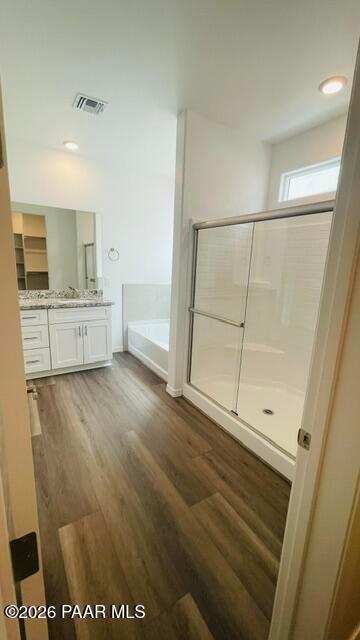 Modern primary bathroom with walk-in shower, soaking tub, and vanity in The Summit A floor plan, Westwood, Prescott, AZ.