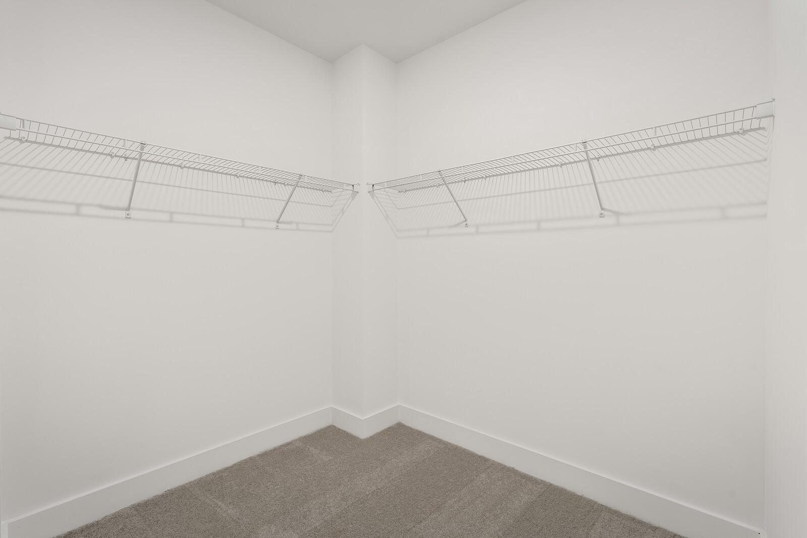 Spacious walk-in closet with white wire shelving in Davidson Homes The Ash A, Gallatin, Tennessee