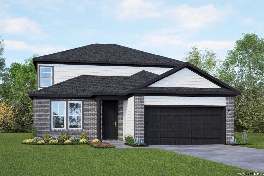 Modern 2-story Douglas C home by Davidson Homes in Horizon Pointe, Converse, TX: white siding, brick accents, 2-car garage, landscaped yard
