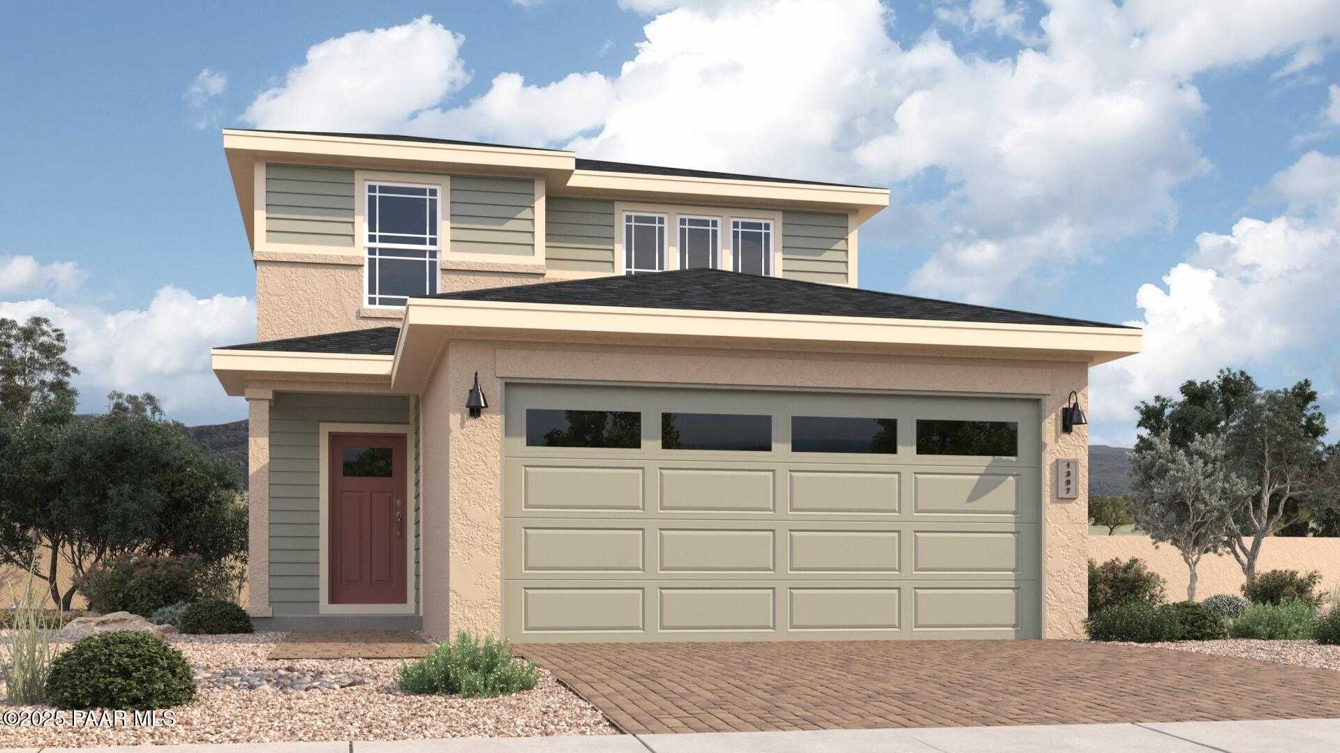 Two-story Wilmington A home by Davidson Homes with beige siding, two-car garage, and desert landscaping in South Ranch, Prescott, Arizona