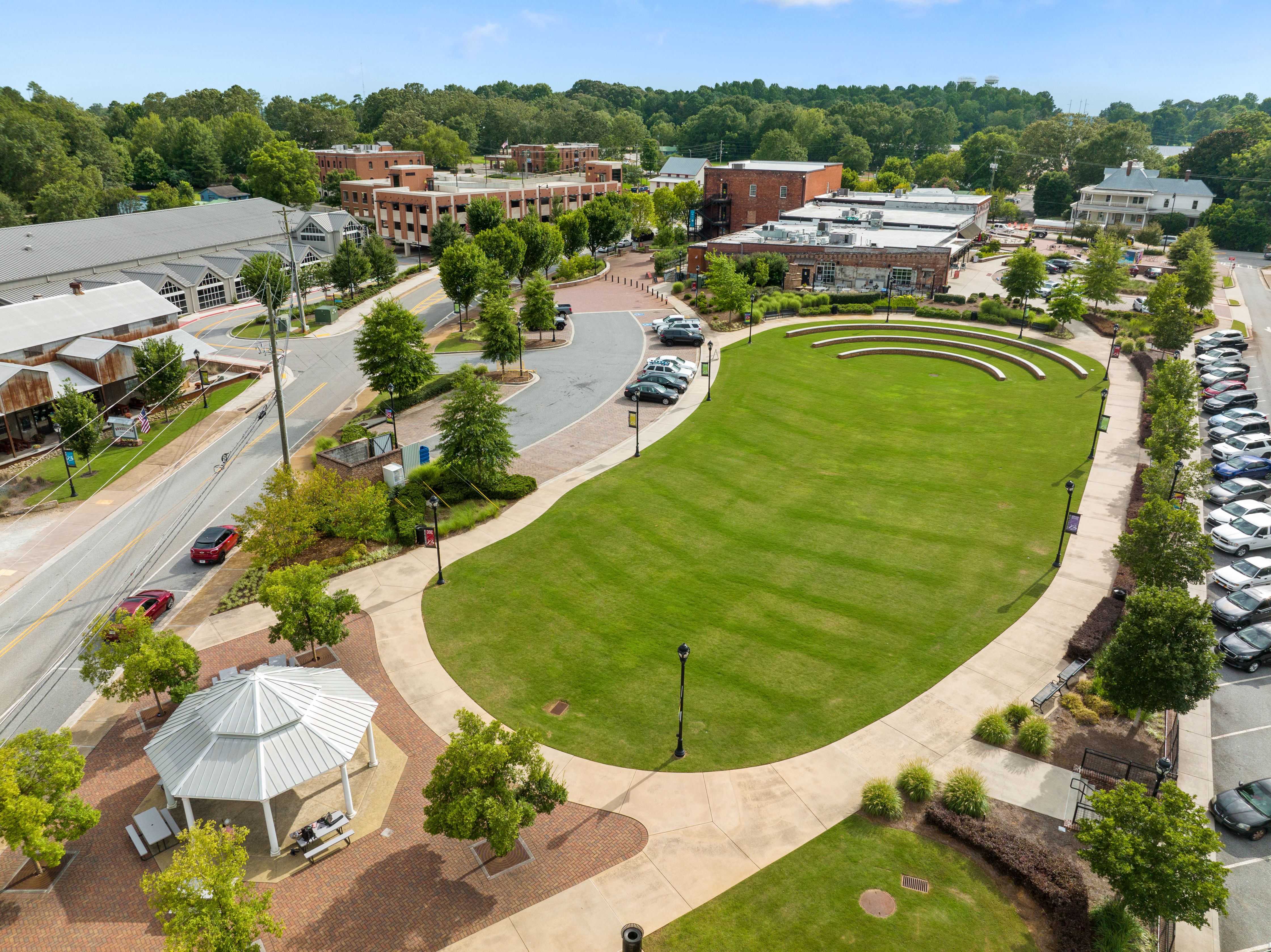 Aerial view of the community park, gazebo, and lawn at Wehunt Meadows in Hoschton, Georgia near Davidson Homes community.