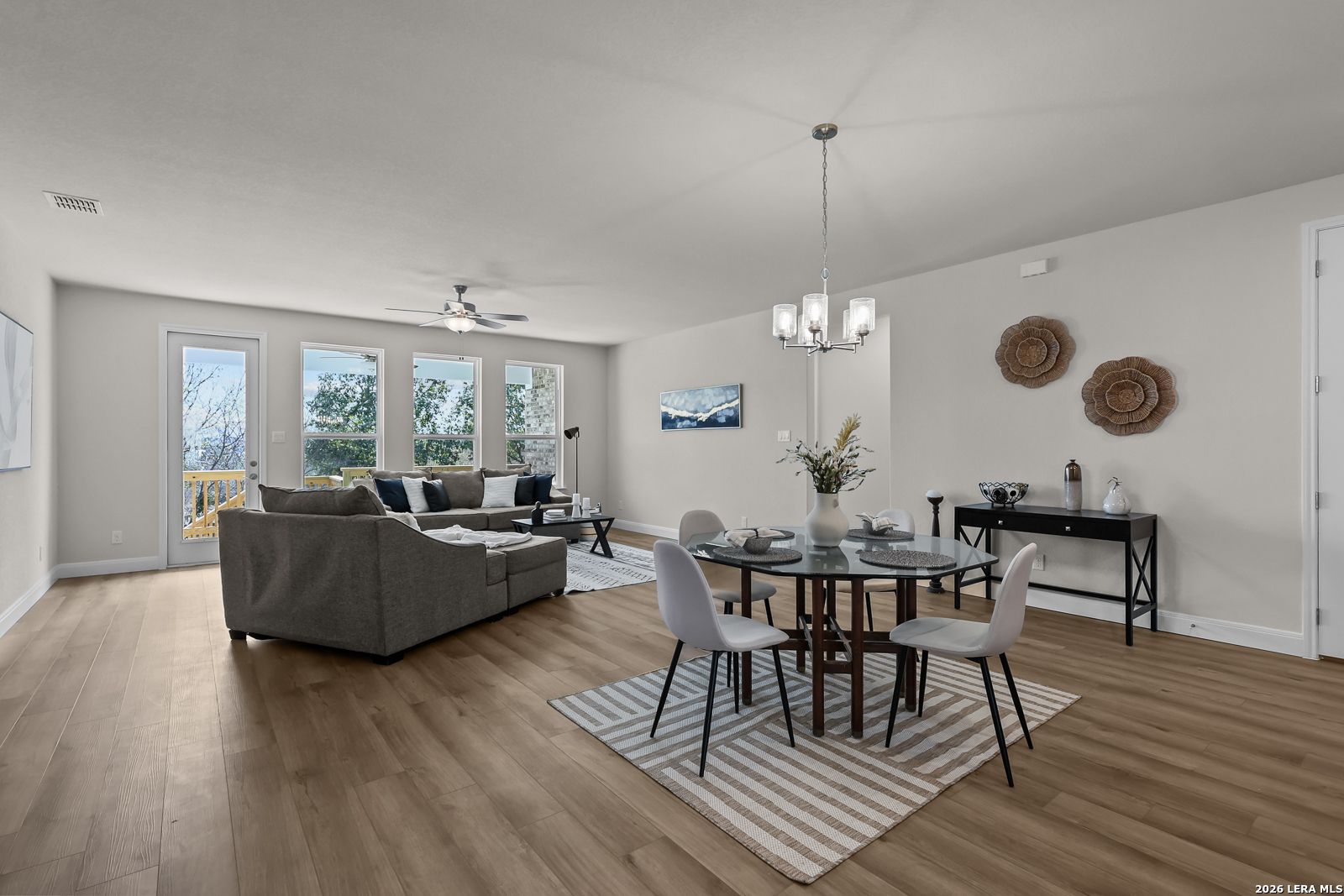 Open-concept living and dining area in The Lanier H floor plan by Davidson Homes in Ladera, San Antonio, Texas.