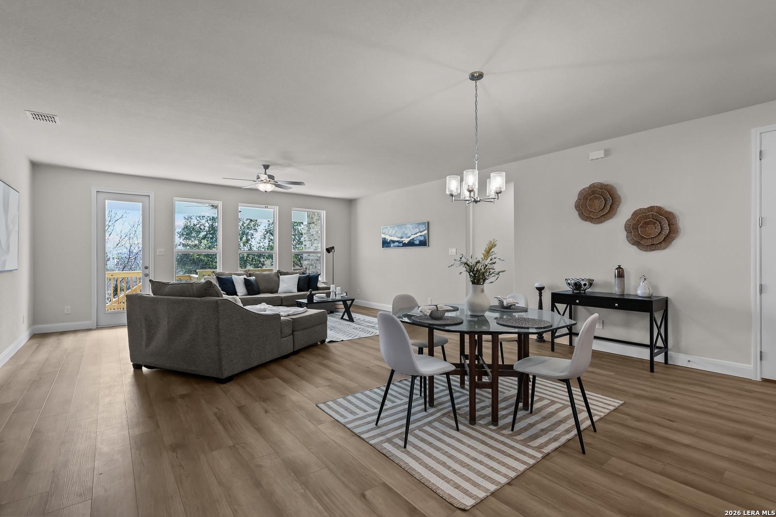 Open-concept living and dining area in The Lanier H floor plan by Davidson Homes in Ladera, San Antonio, Texas.