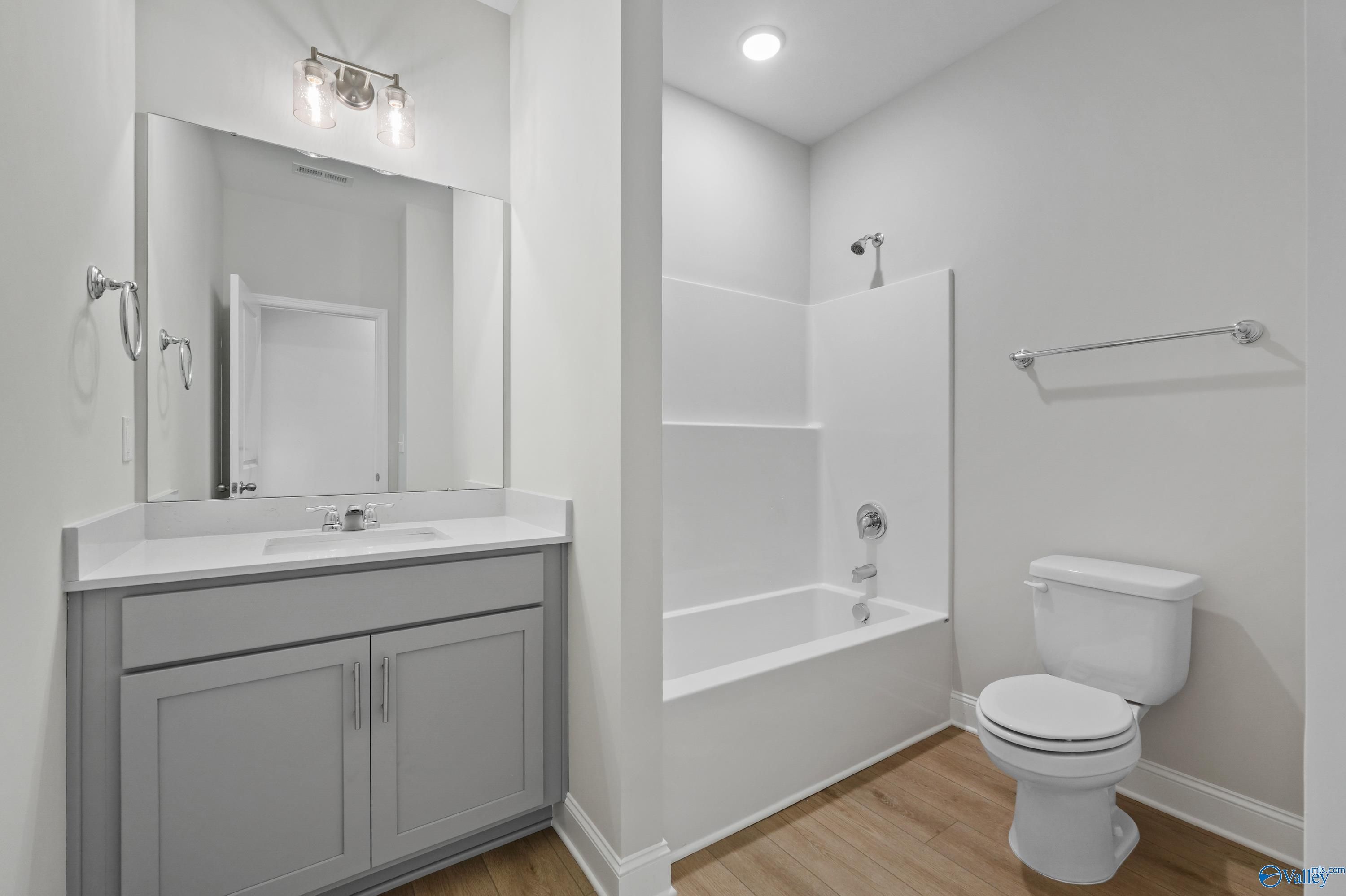 Spacious master bathroom with double gray vanity, soaking tub, glass shower in Davidson Homes The Everett, Hazel Green, AL