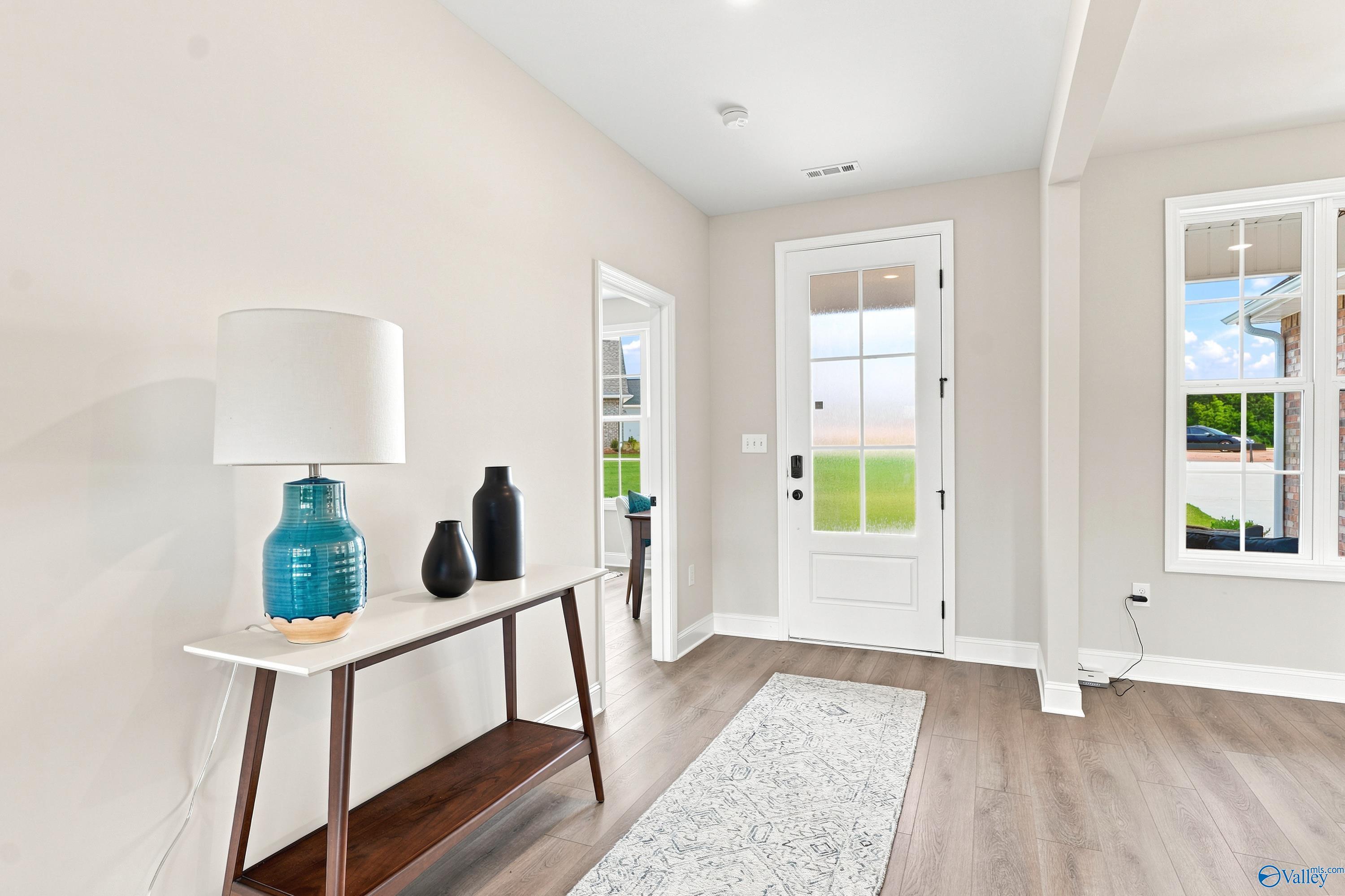 Bright entryway with modern console table in The Finleigh floor plan at Riverton Preserve, Huntsville, Alabama.