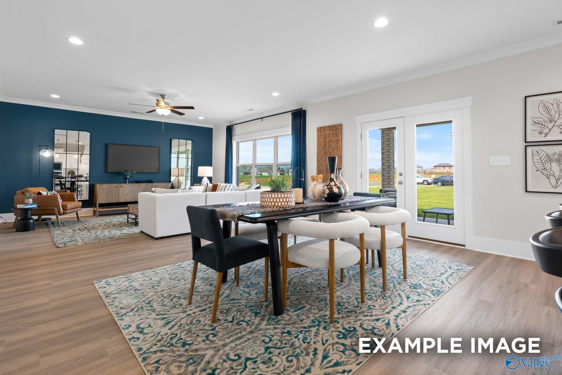 Open-concept dining and living area in The Chelsea B floor plan by Davidson Homes in Ramsay Cove, Owens Cross Roads, AL.