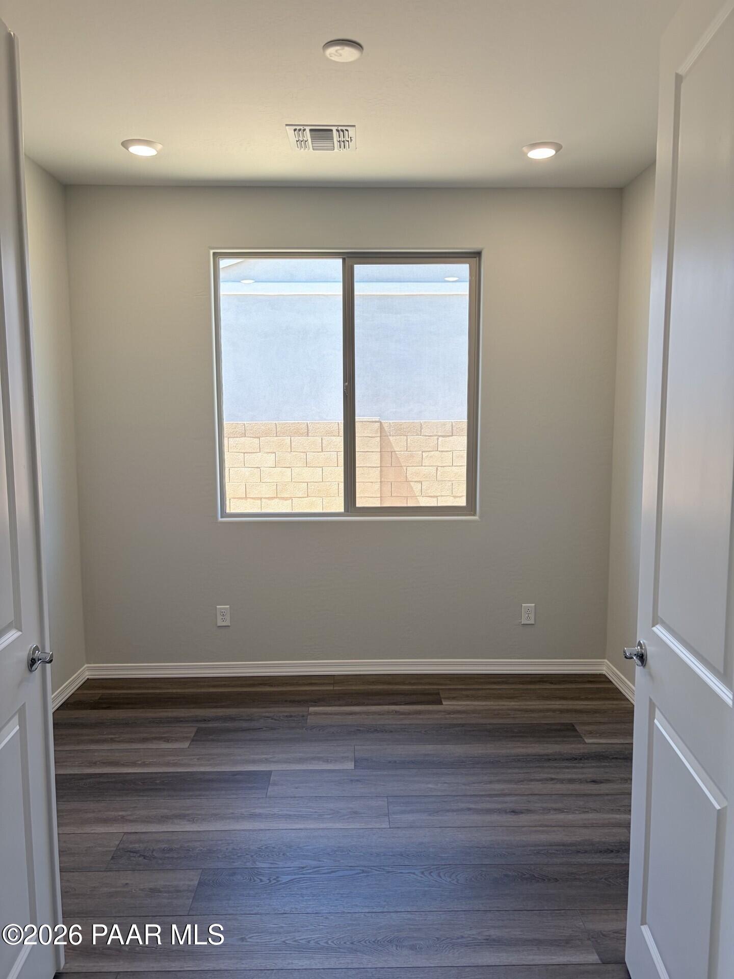 Bright bedroom with wood-look flooring in The Frontier A floor plan at North Ridge, Pronghorn Ranch, Prescott Valley, AZ.