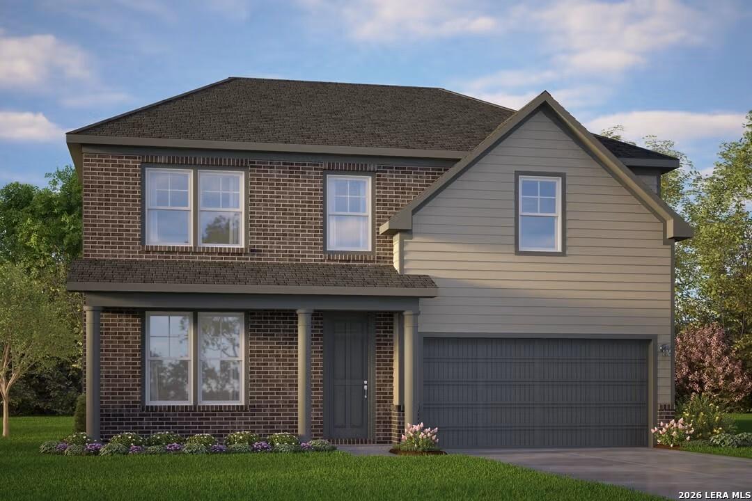 Modern two-story brick and siding home with 2-car garage, front porch, and landscaped yard in Horizon Pointe, Converse, Texas