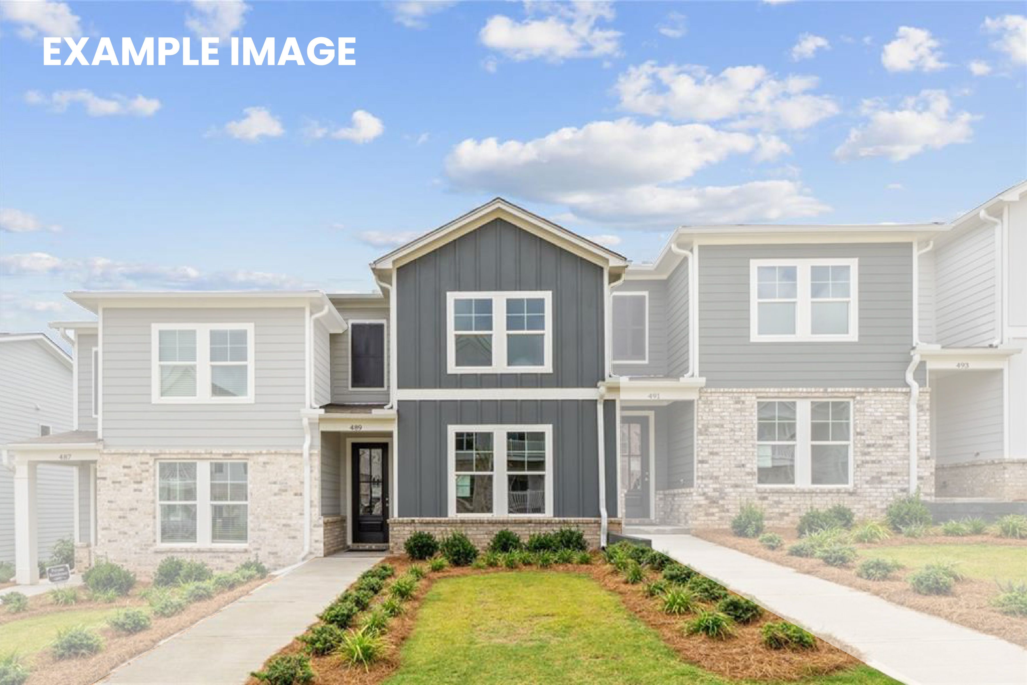 Modern two-story townhomes with gray siding, brick accents, front porches, and landscaped yards in Stegall Village, Emerson, Georgia