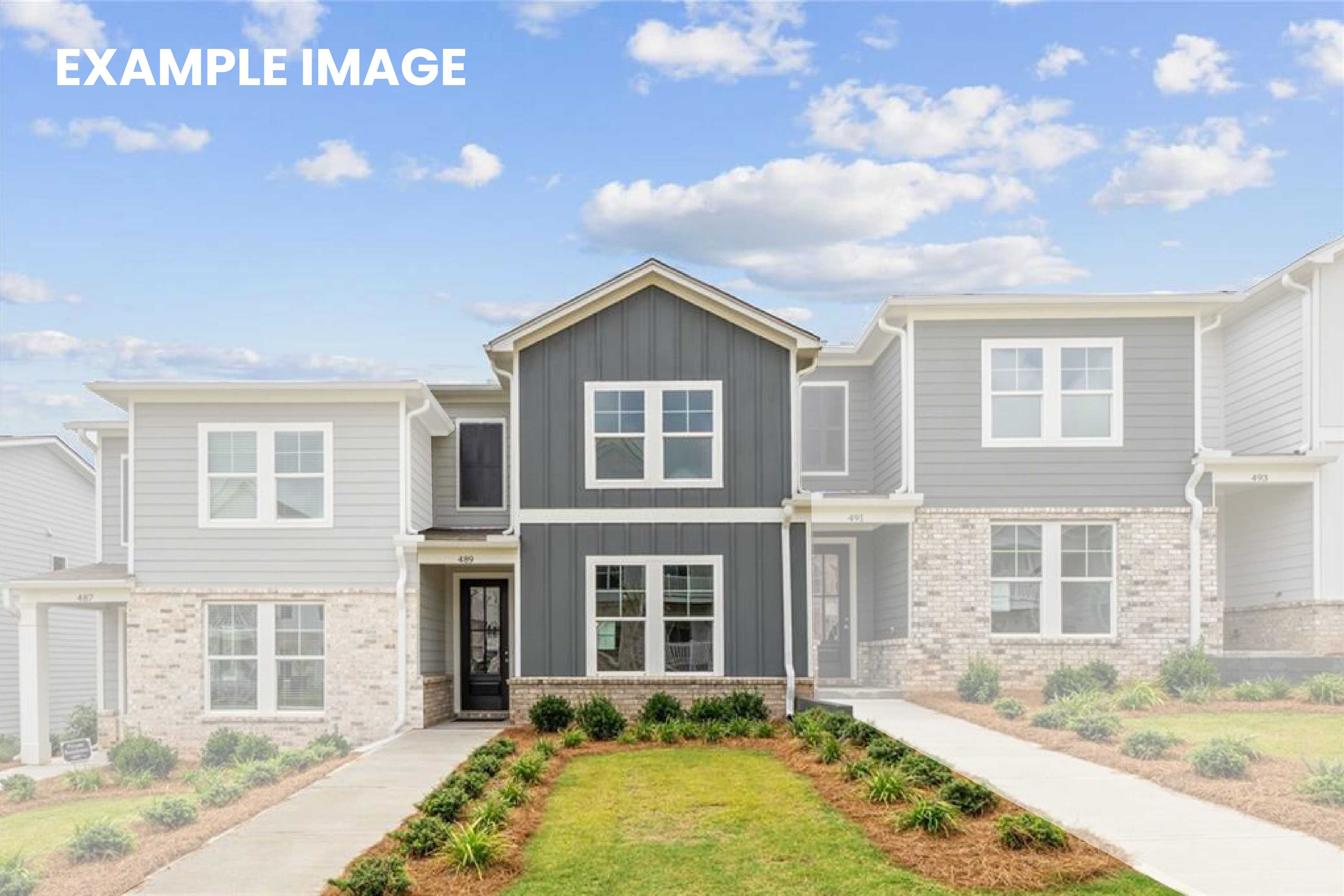 Modern two-story townhomes with gray siding, brick accents, front porches, and landscaped yards in Stegall Village, Emerson, Georgia