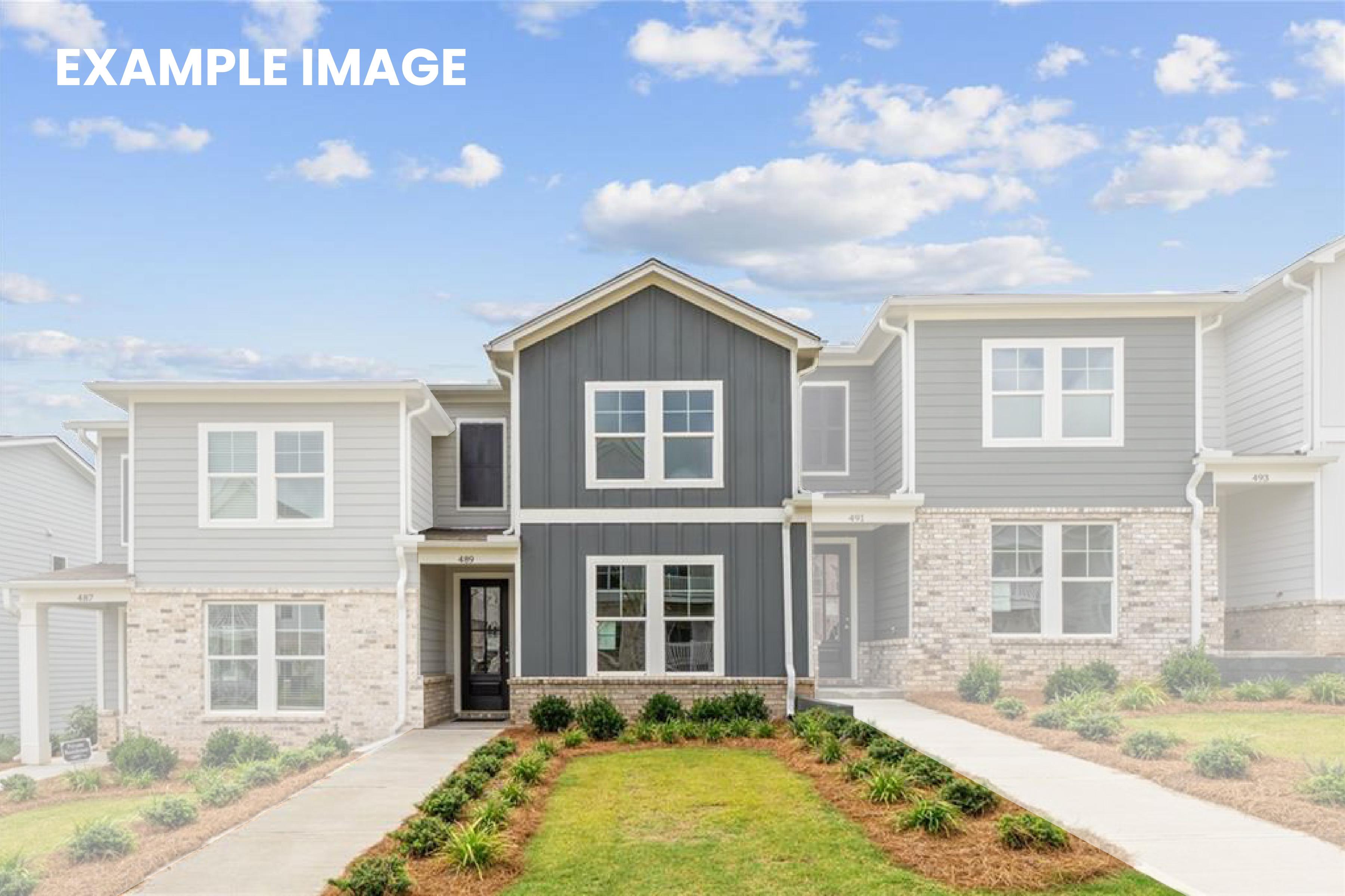 Modern two-story townhomes with gray siding, brick accents, front porches, and landscaped yards in Stegall Village, Emerson, Georgia