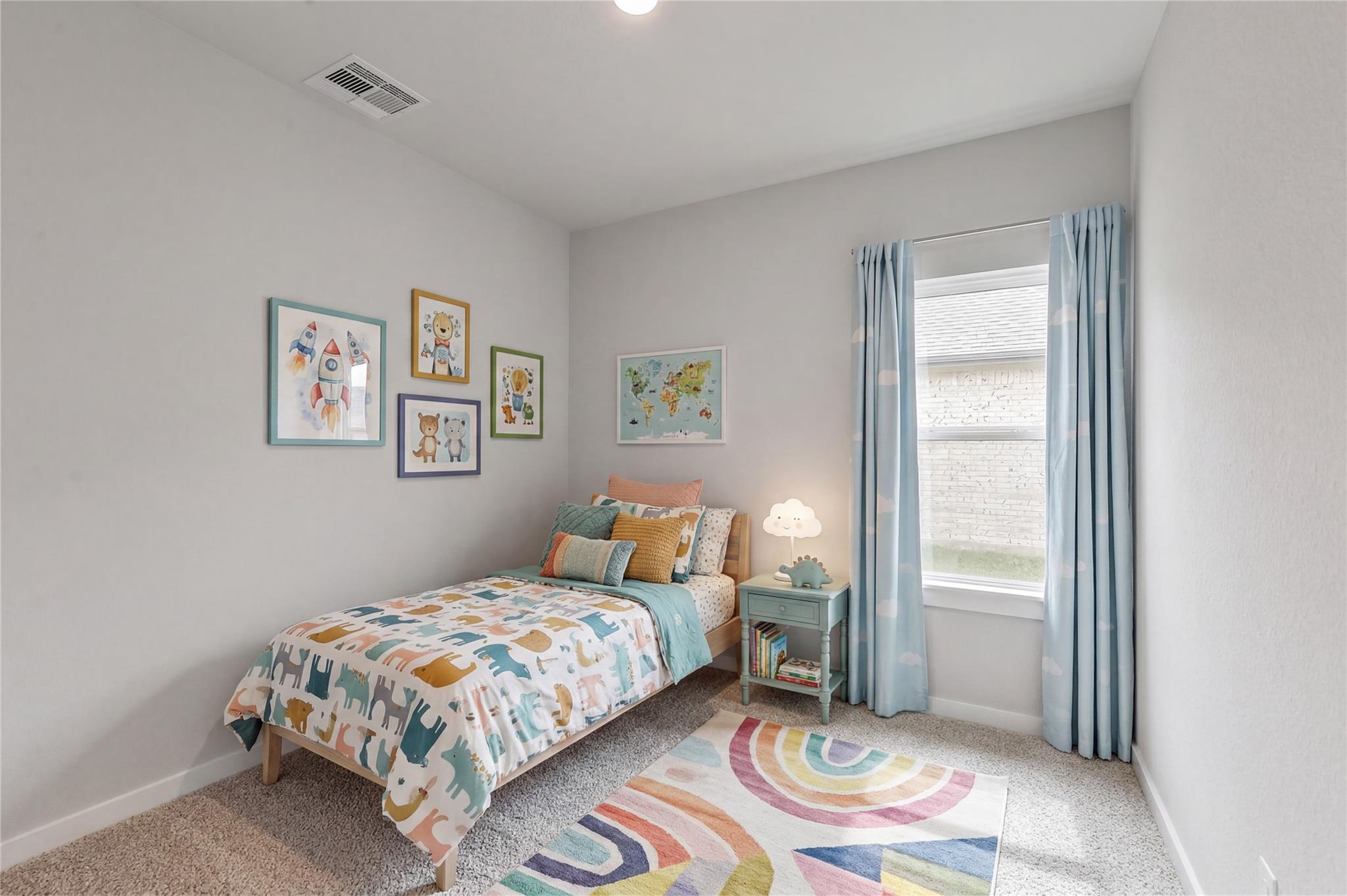 Cozy, colorful child’s bedroom in The Colorado G floor plan at Windmill Estates, Magnolia, Texas.