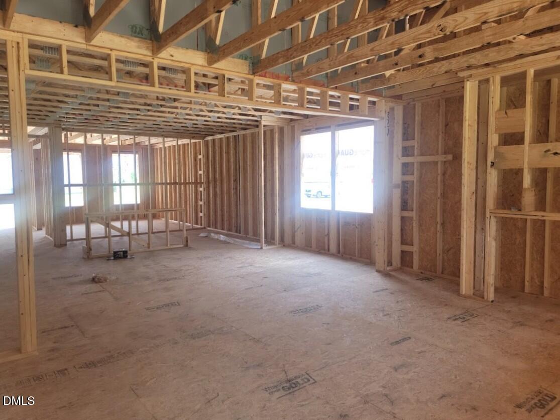 Wood framing of an open-concept living area in a new Davidson Homes Birch II A floor plan construction in Angier, NC.